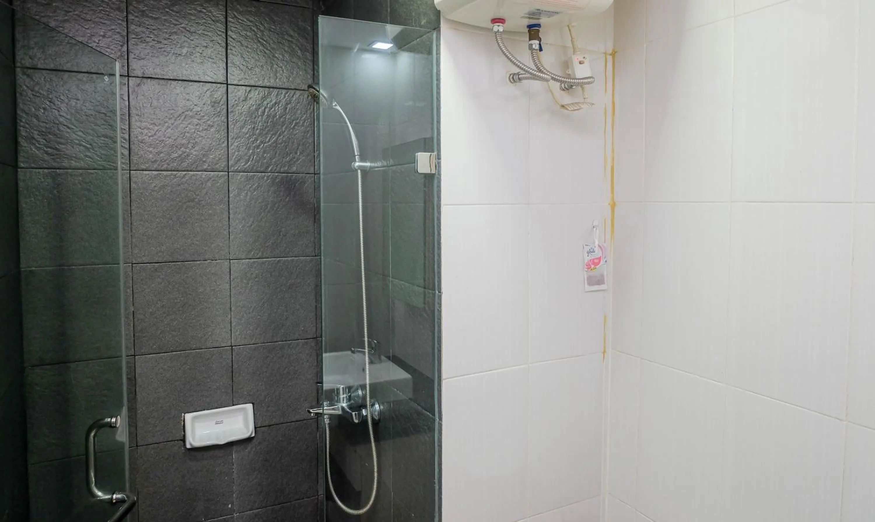 Good Location with Simply Furnished 1BR Apartment Woodland Park Residence By Travelio