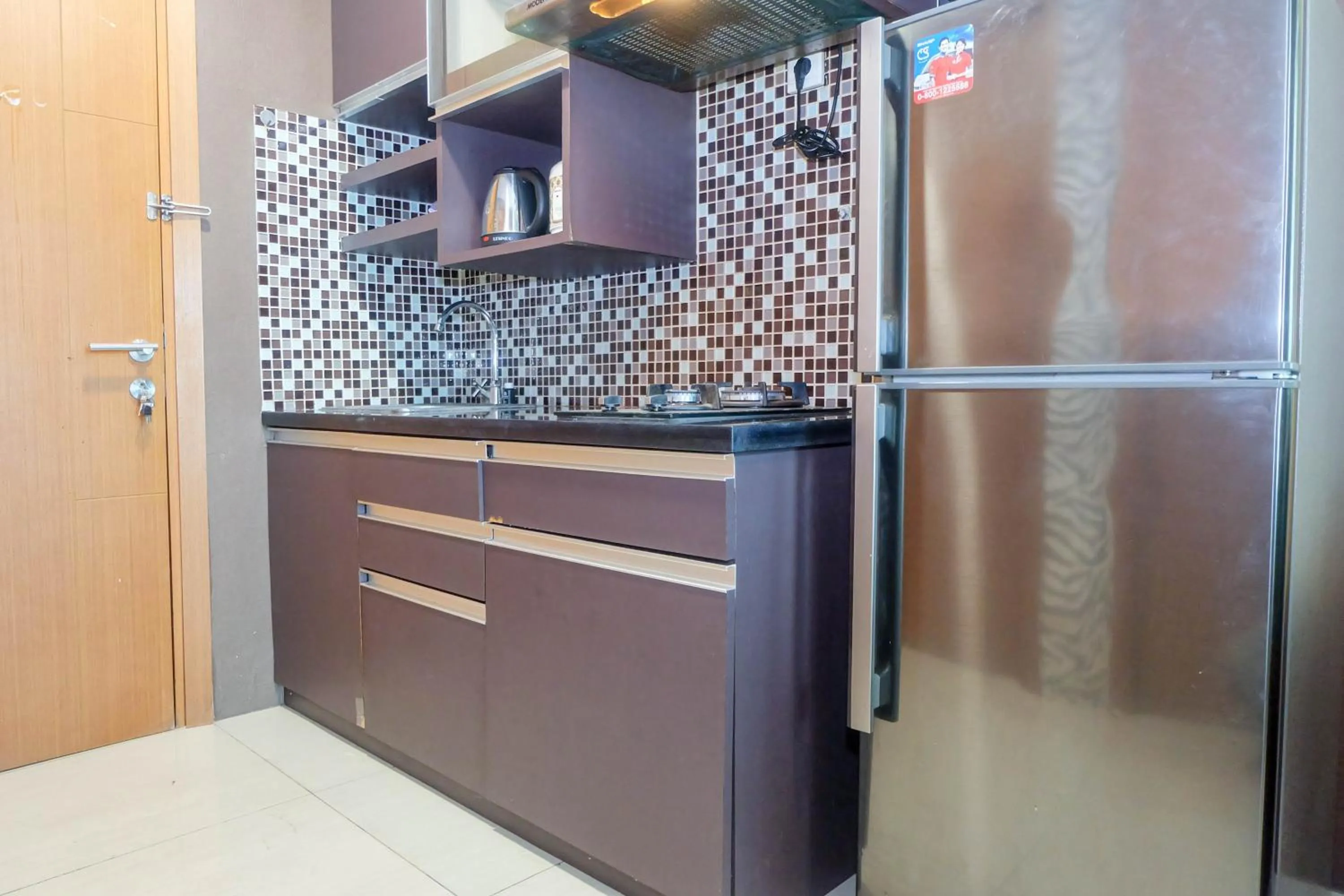 Kitchen or kitchenette in Good Location with Simply Furnished 1BR Apartment Woodland Park Residence By Travelio