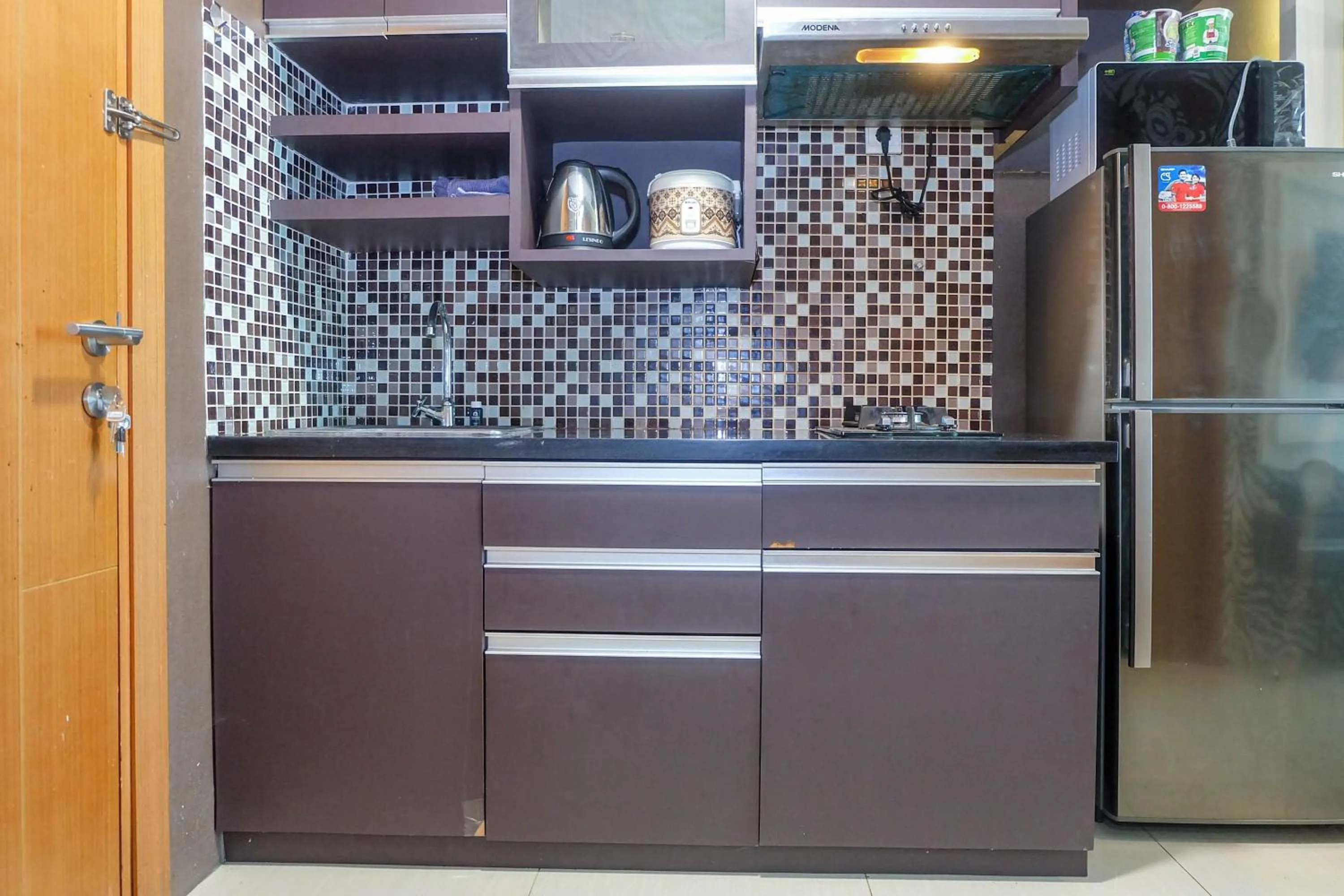 Good Location with Simply Furnished 1BR Apartment Woodland Park Residence By Travelio