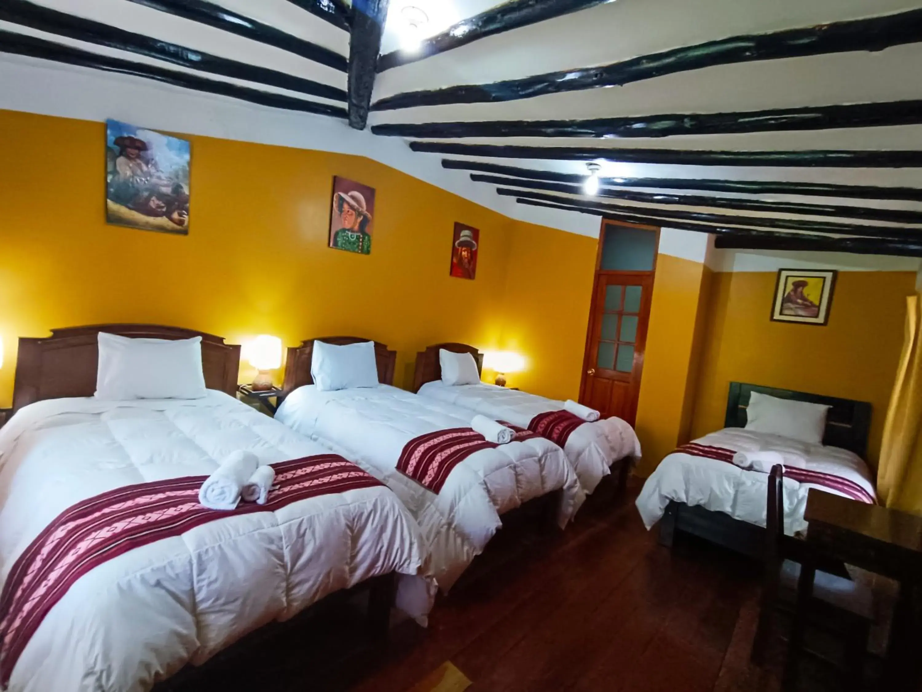 Quadruple Room with Private Bathroom in Wayras Hostal Quadruple Room with Private Bathroom in Wayras Hostal