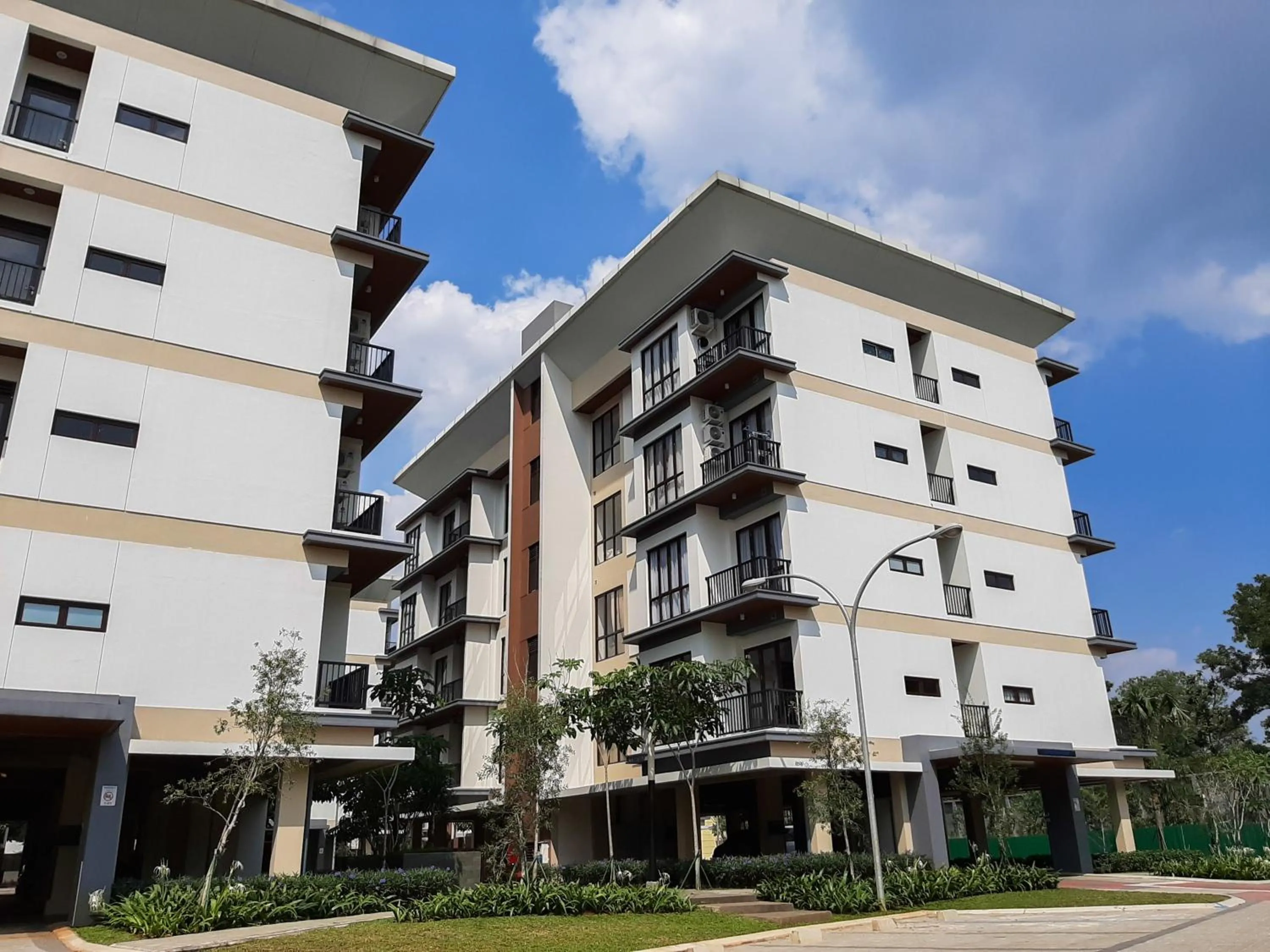 Property building in Cozy 1BR Asatti Apartment By Travelio
