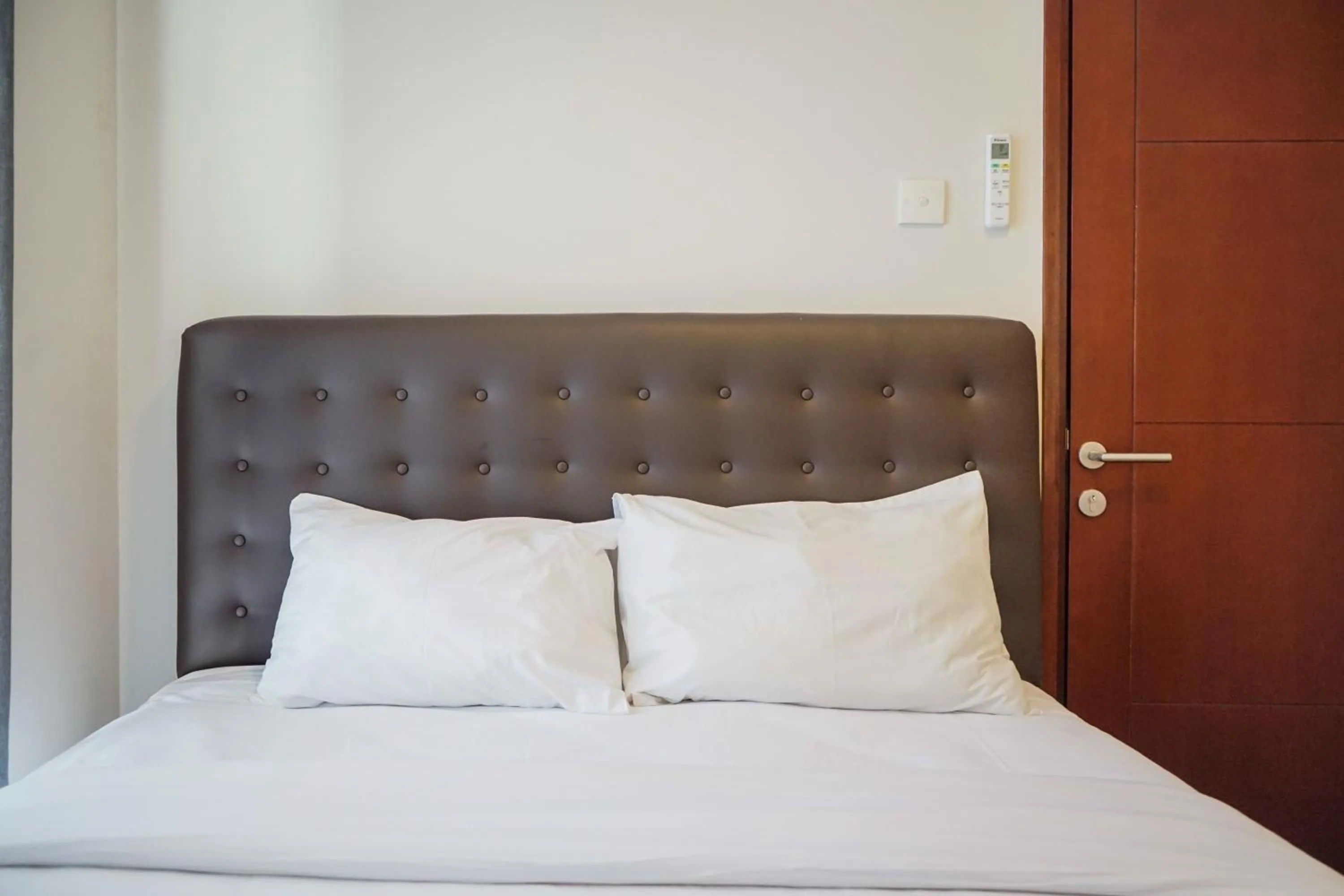 Bed in Cozy 1BR Asatti Apartment By Travelio