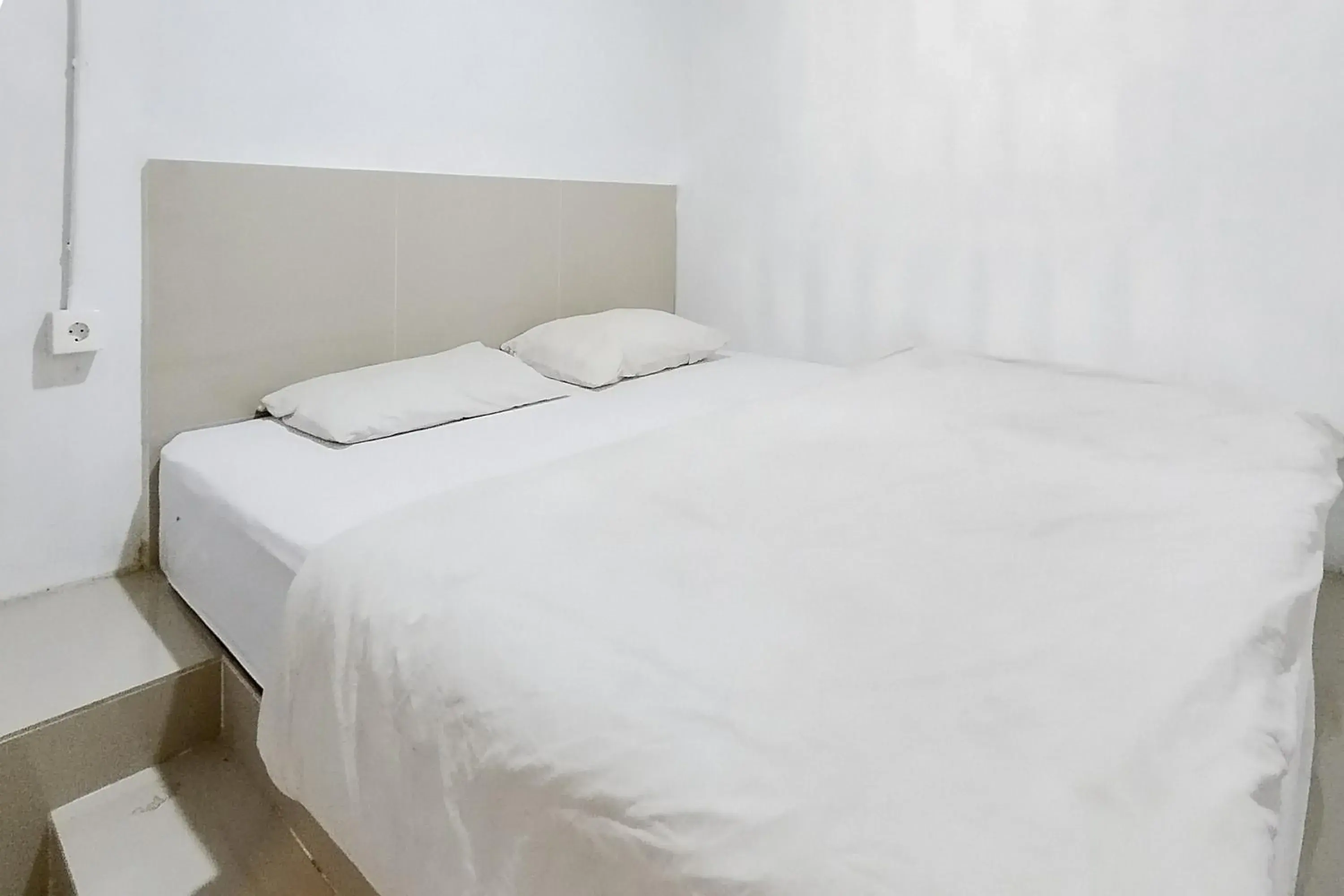 Bed in Alfalah Residence Syariah Mitra RedDoorz Bed in Alfalah Residence Syariah Mitra RedDoorz