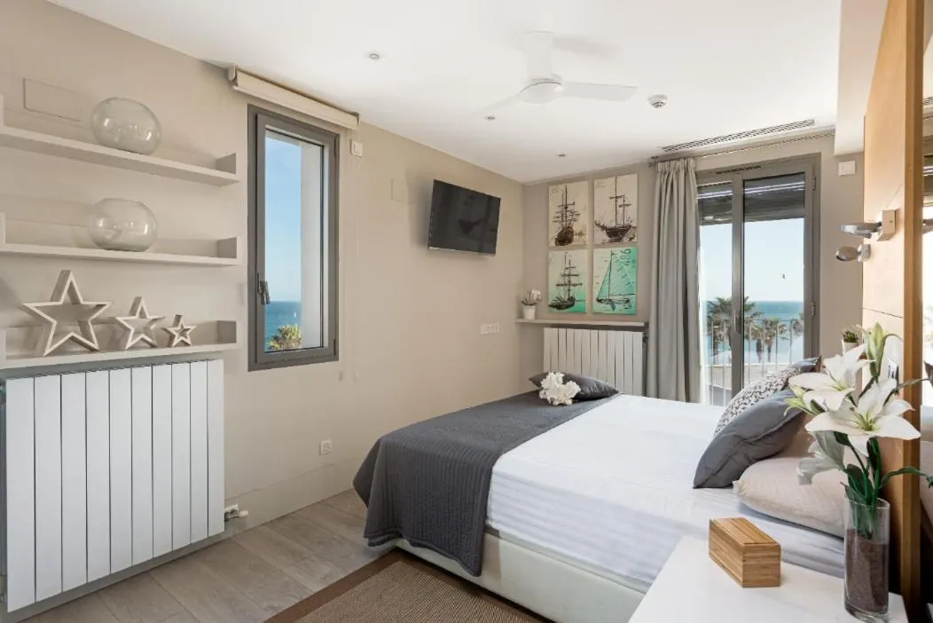 Bed in Kronos on the Beach Attic Suite
