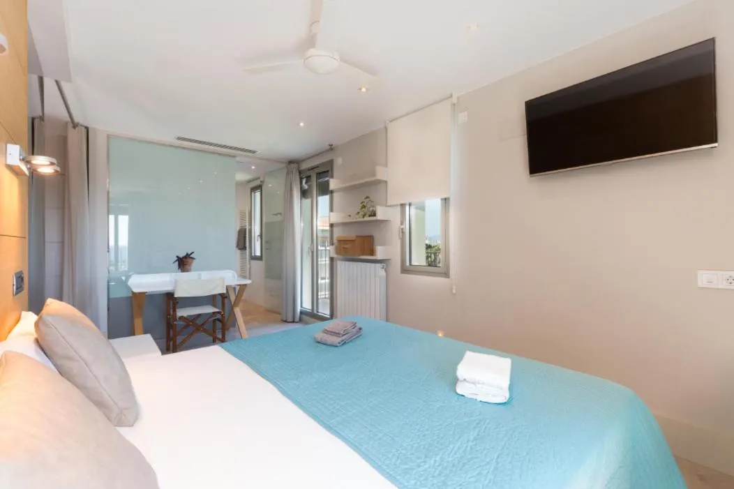 Bed in Kronos on the Beach Attic Suite