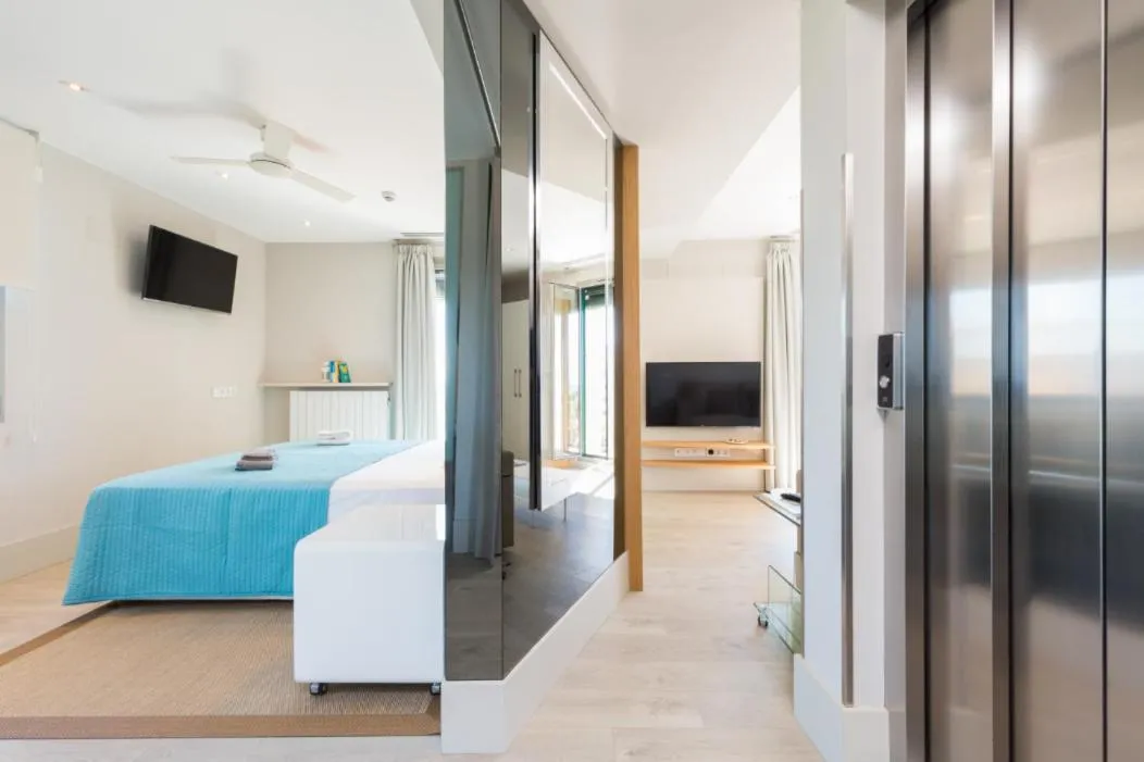 Bed in Kronos on the Beach Attic Suite