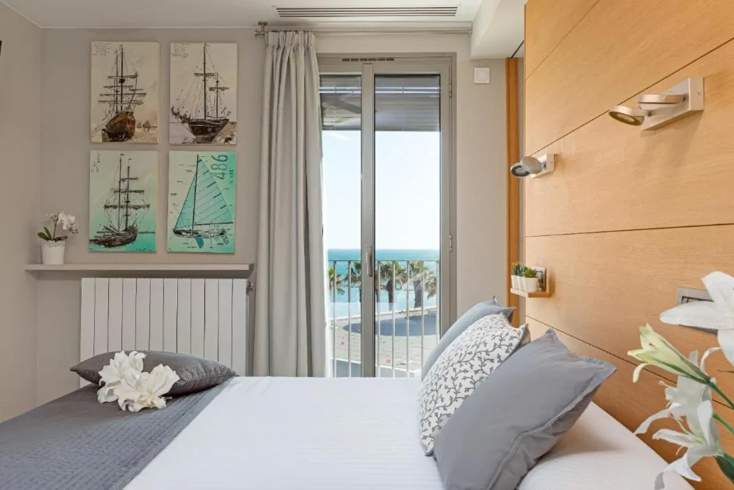 Bed in Kronos on the Beach Attic Suite