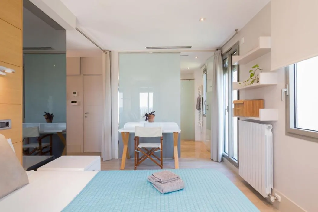 Bed in Kronos on the Beach Attic Suite