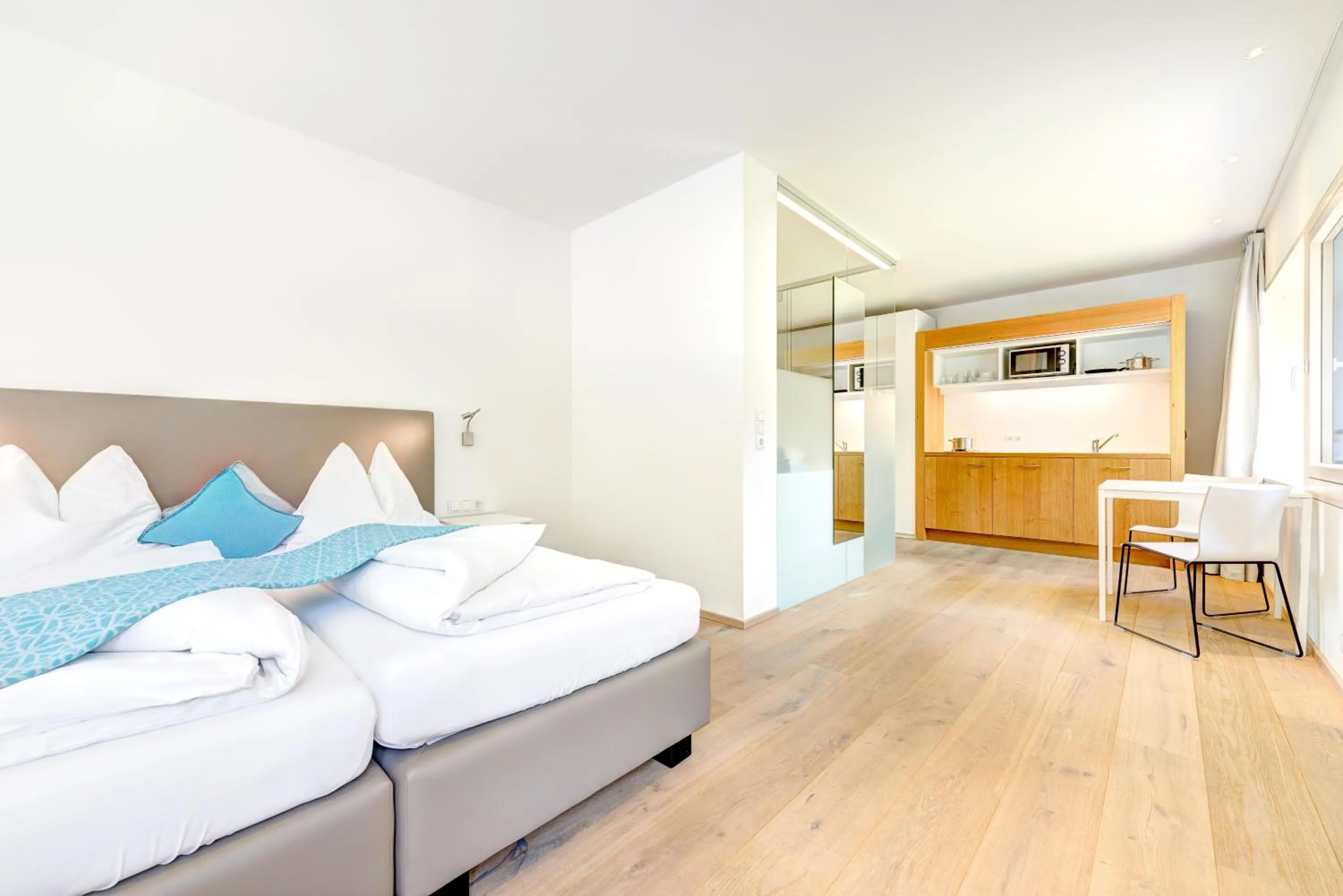 Kitchen or kitchenette, Bed in Hotel Lün