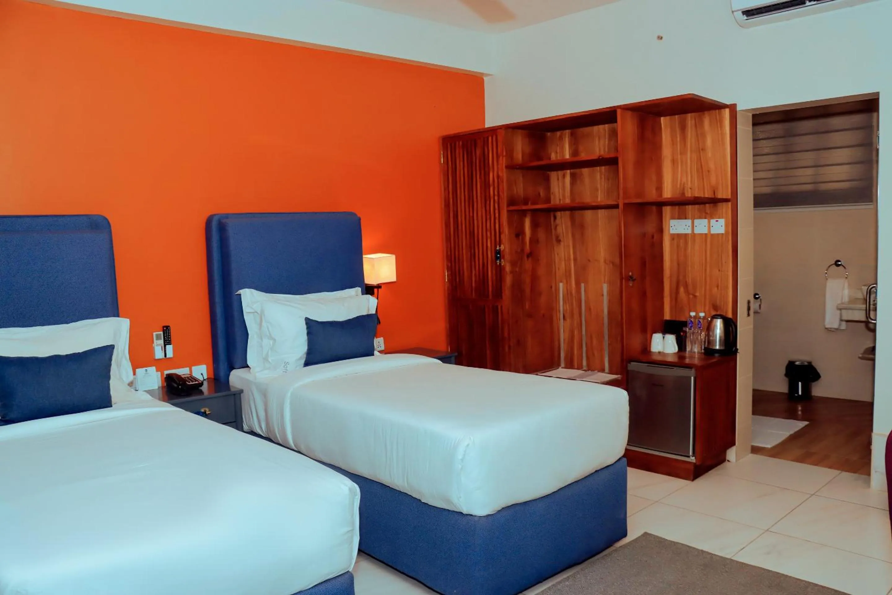 Bed in Best Western Jangwani Sea Breeze Resort