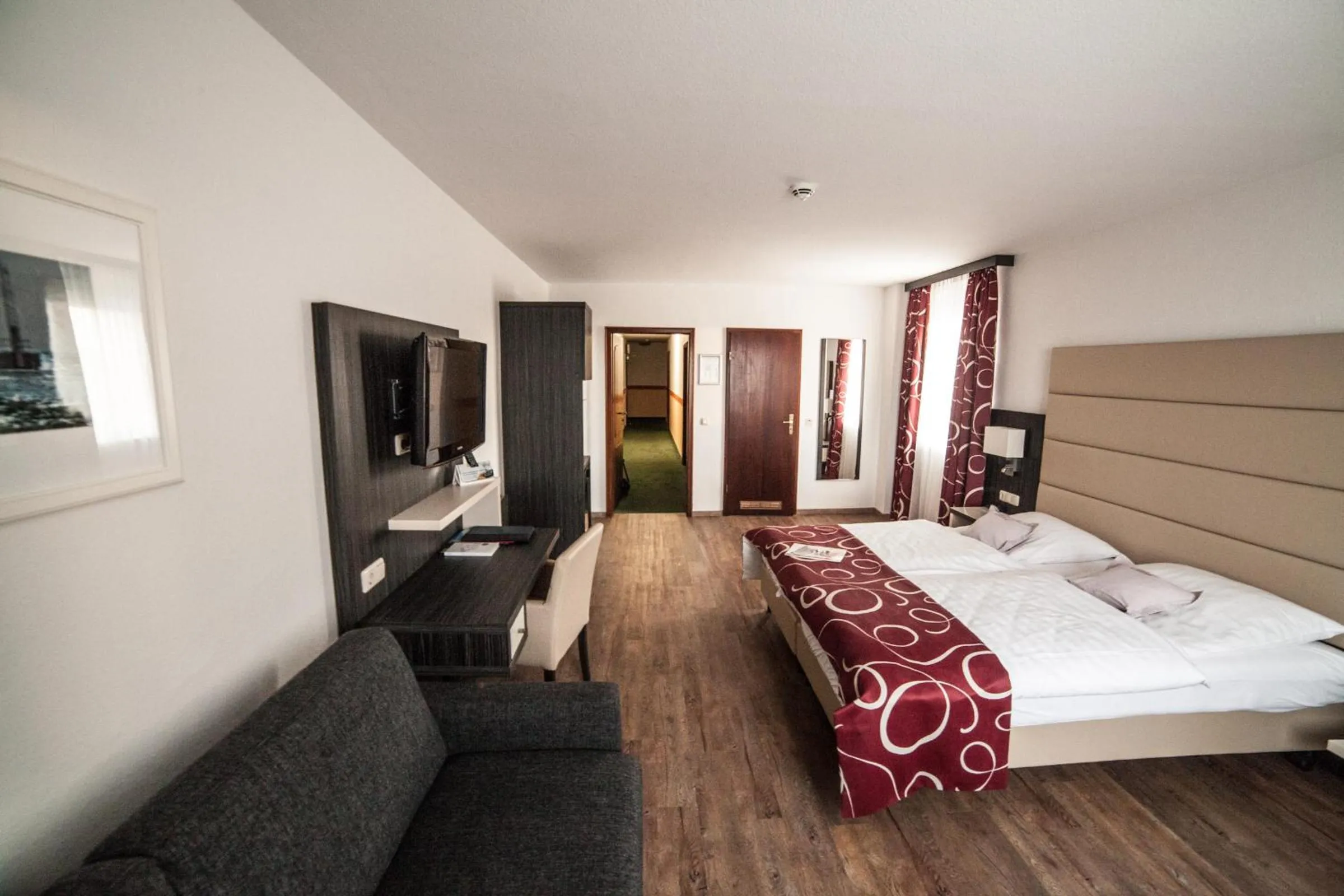 Photo of the whole room, Bed in Hotel Stadt Cuxhaven