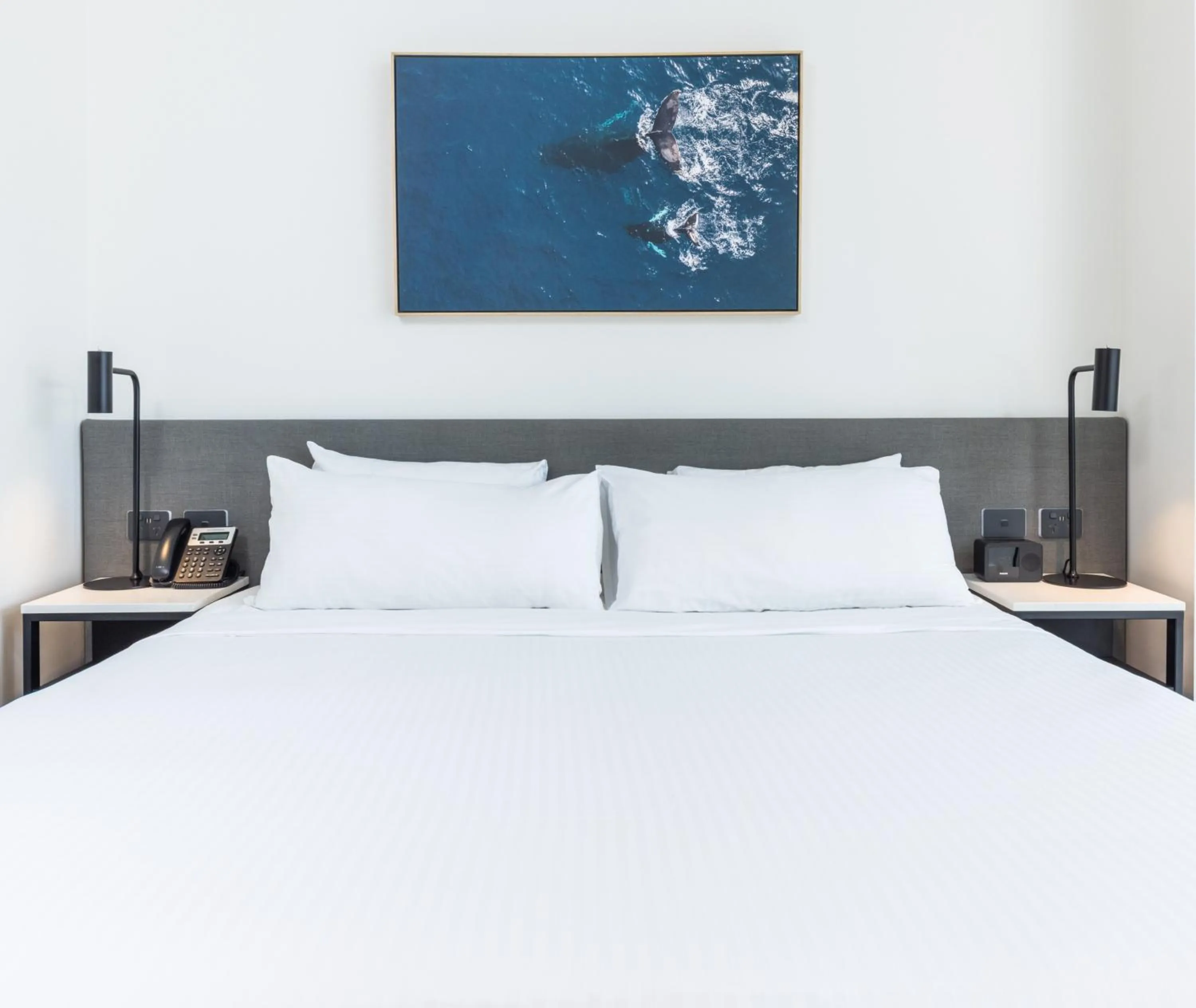 Bed in Oaks Cairns Hotel