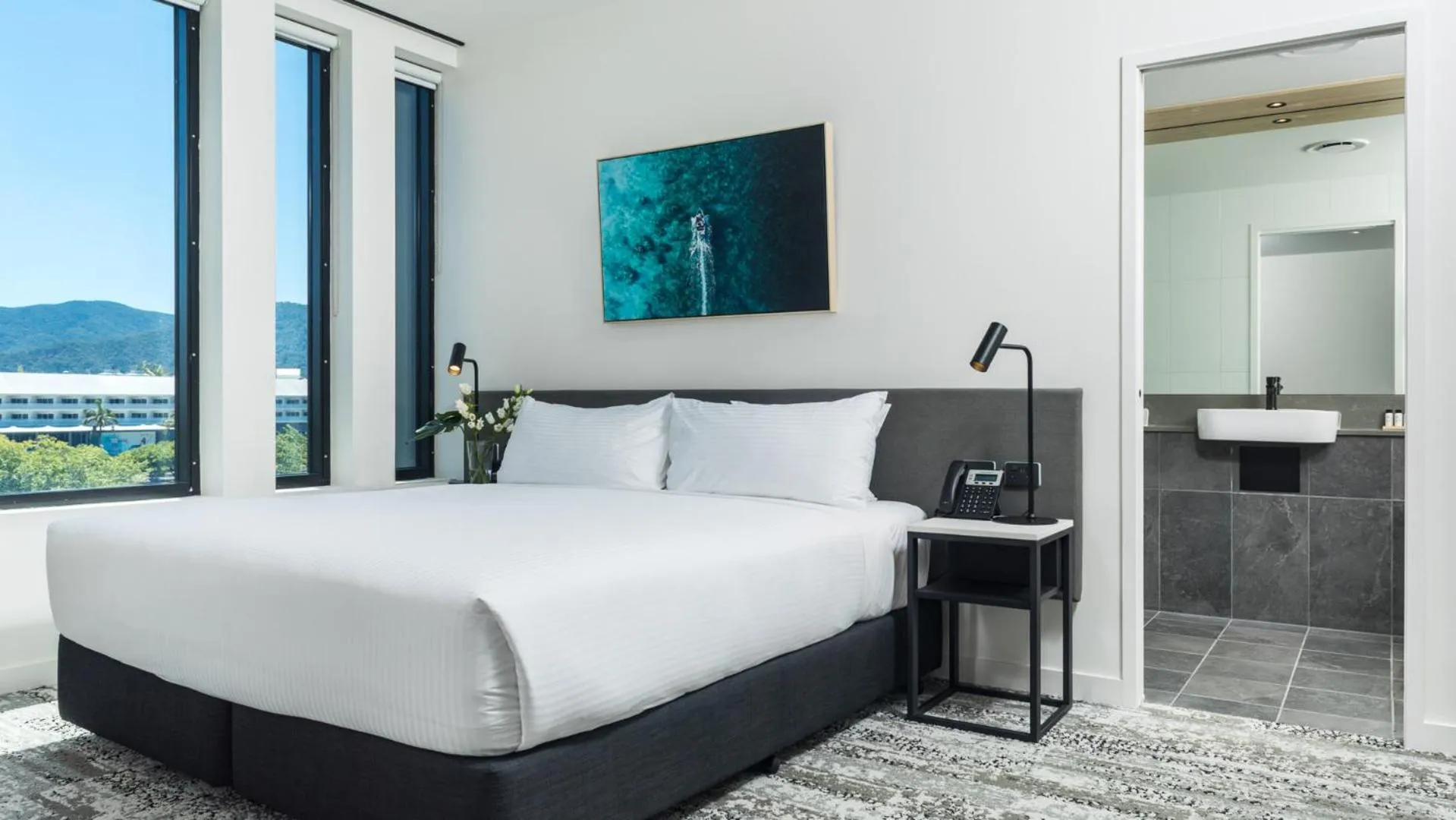 Bed in Oaks Cairns Hotel