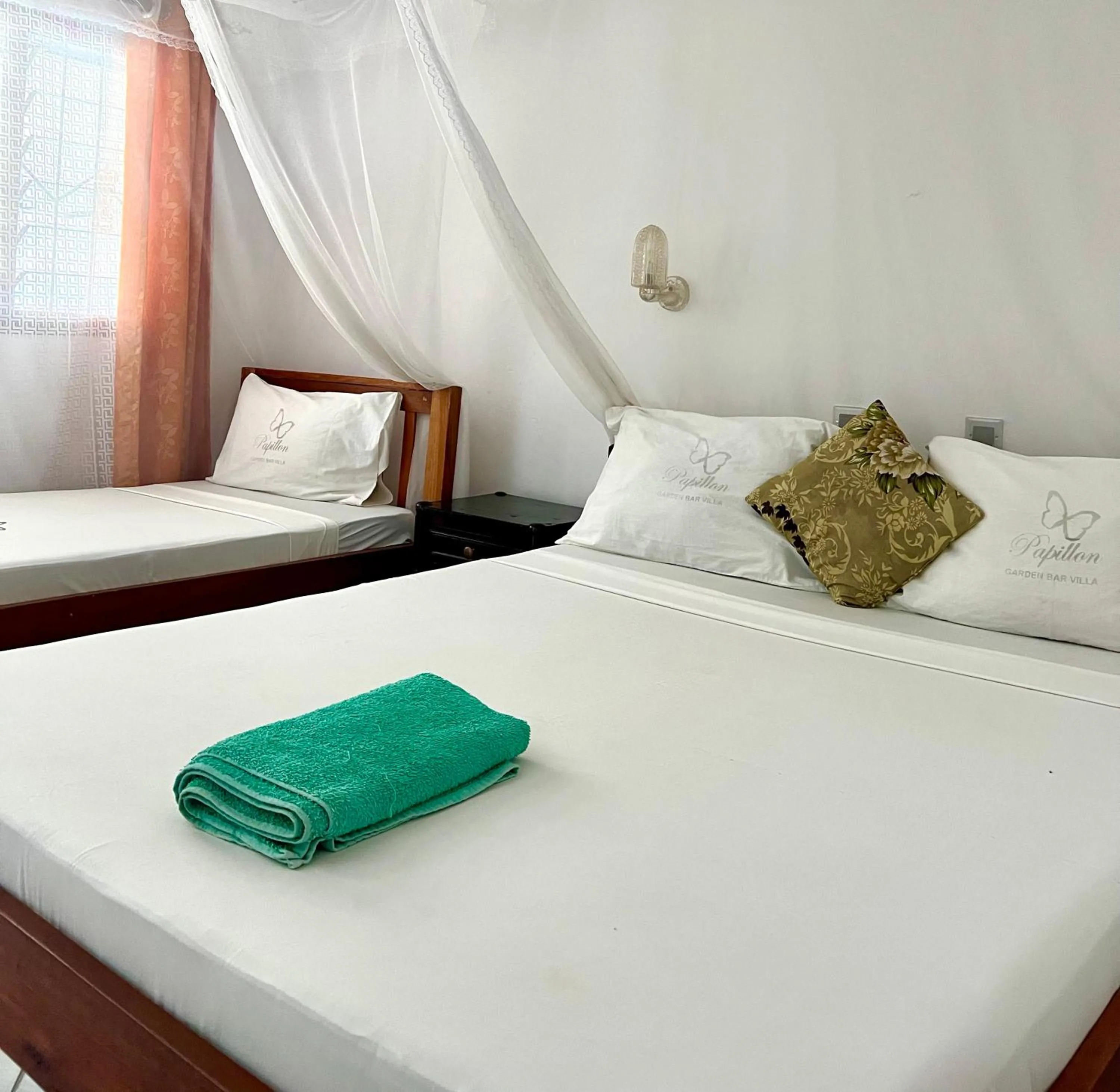 Bed in Papillon Garden Bar Villas