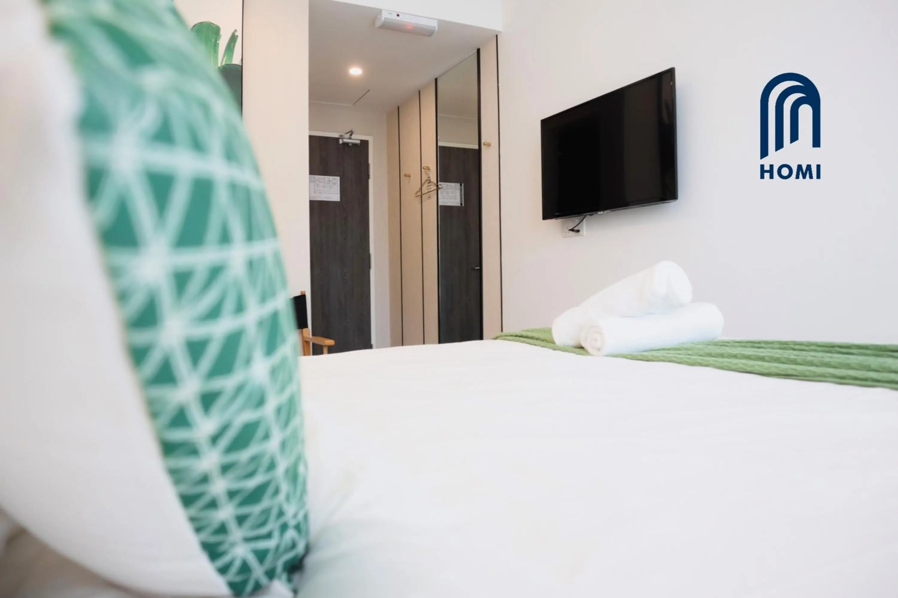 Bed in Homi Oasis at KK Times Square 和逸绿洲