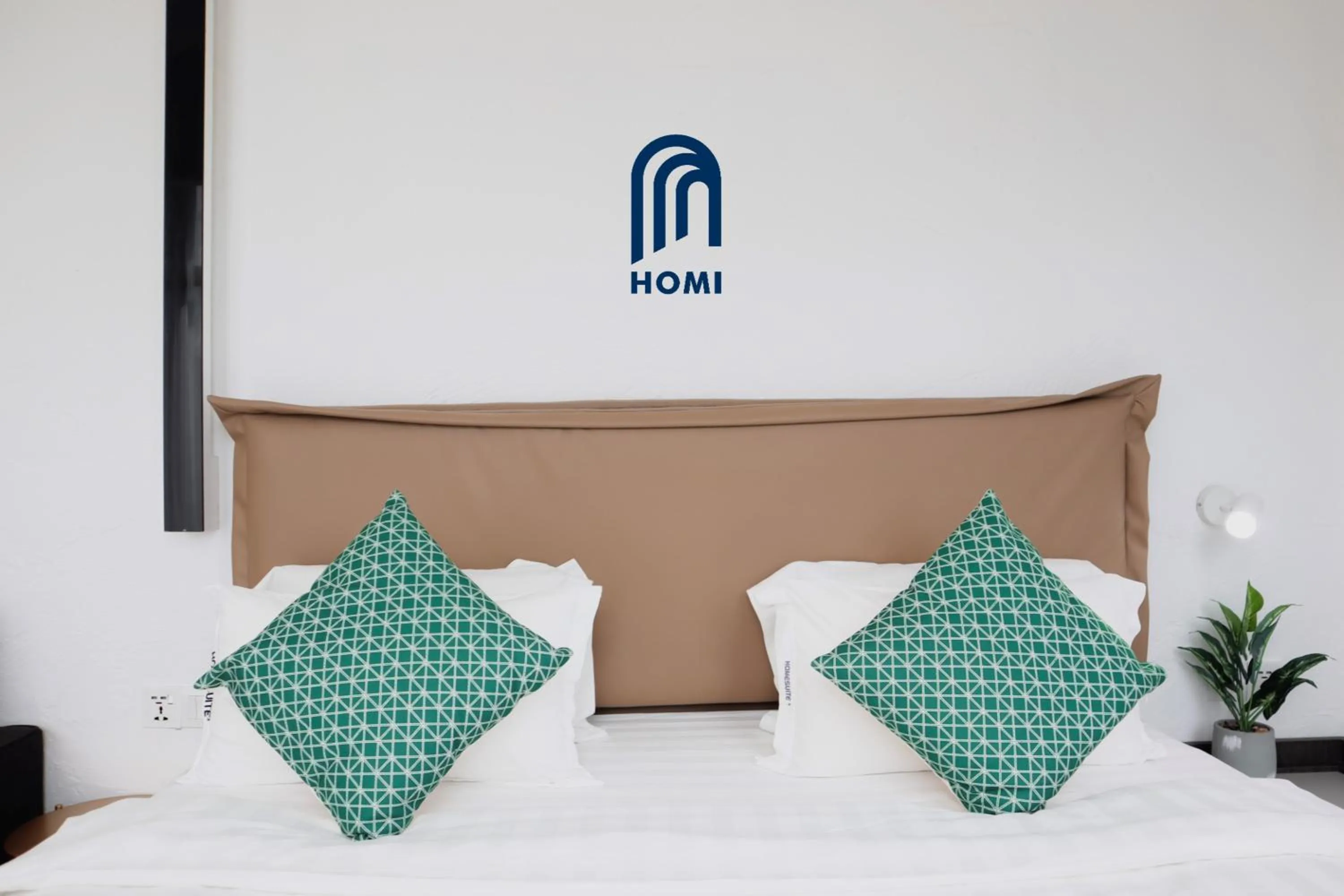 Photo of the whole room, Bed in Homi Oasis at KK Times Square 和逸绿洲