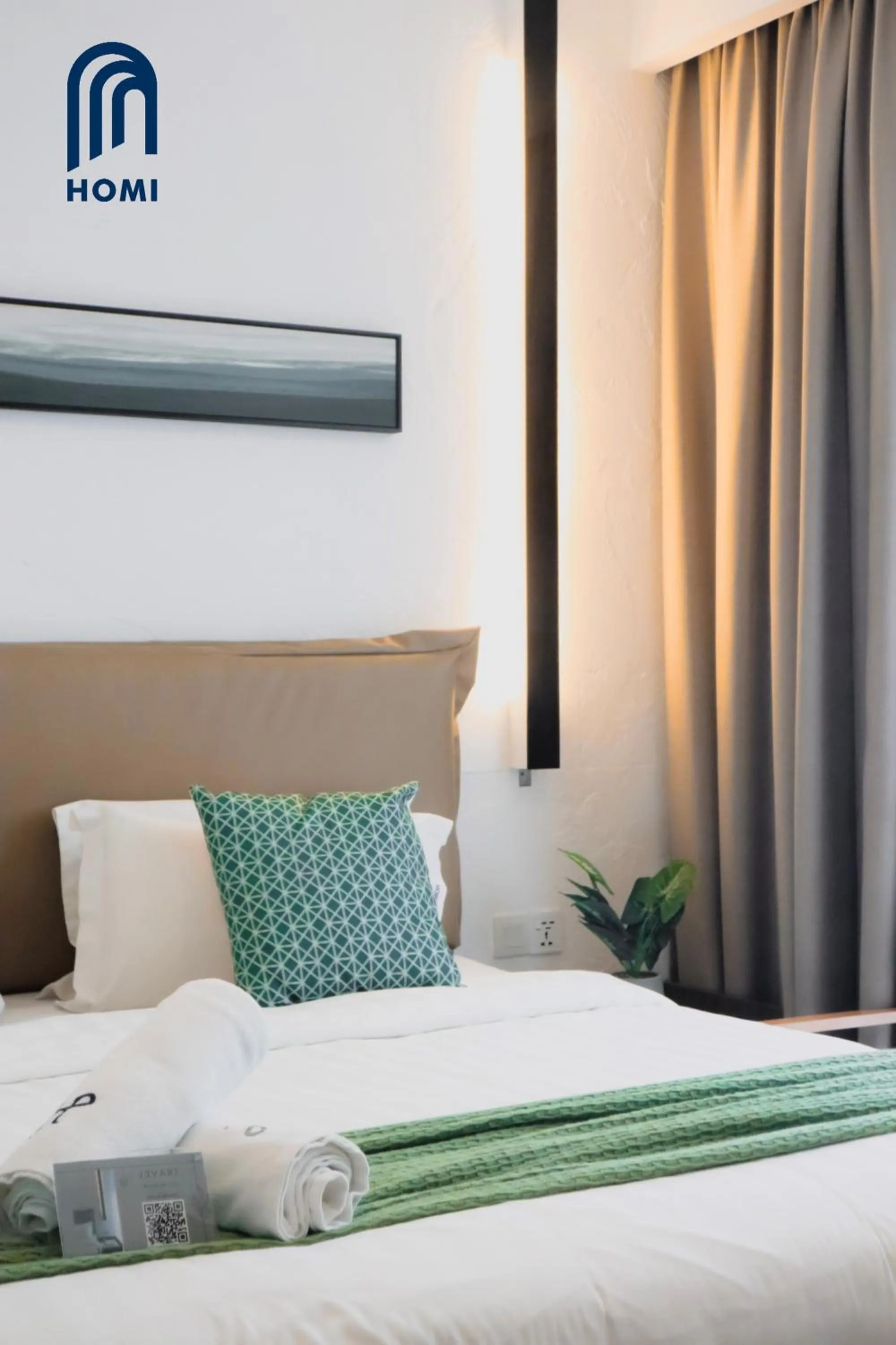 Photo of the whole room, Bed in Homi Oasis at KK Times Square 和逸绿洲