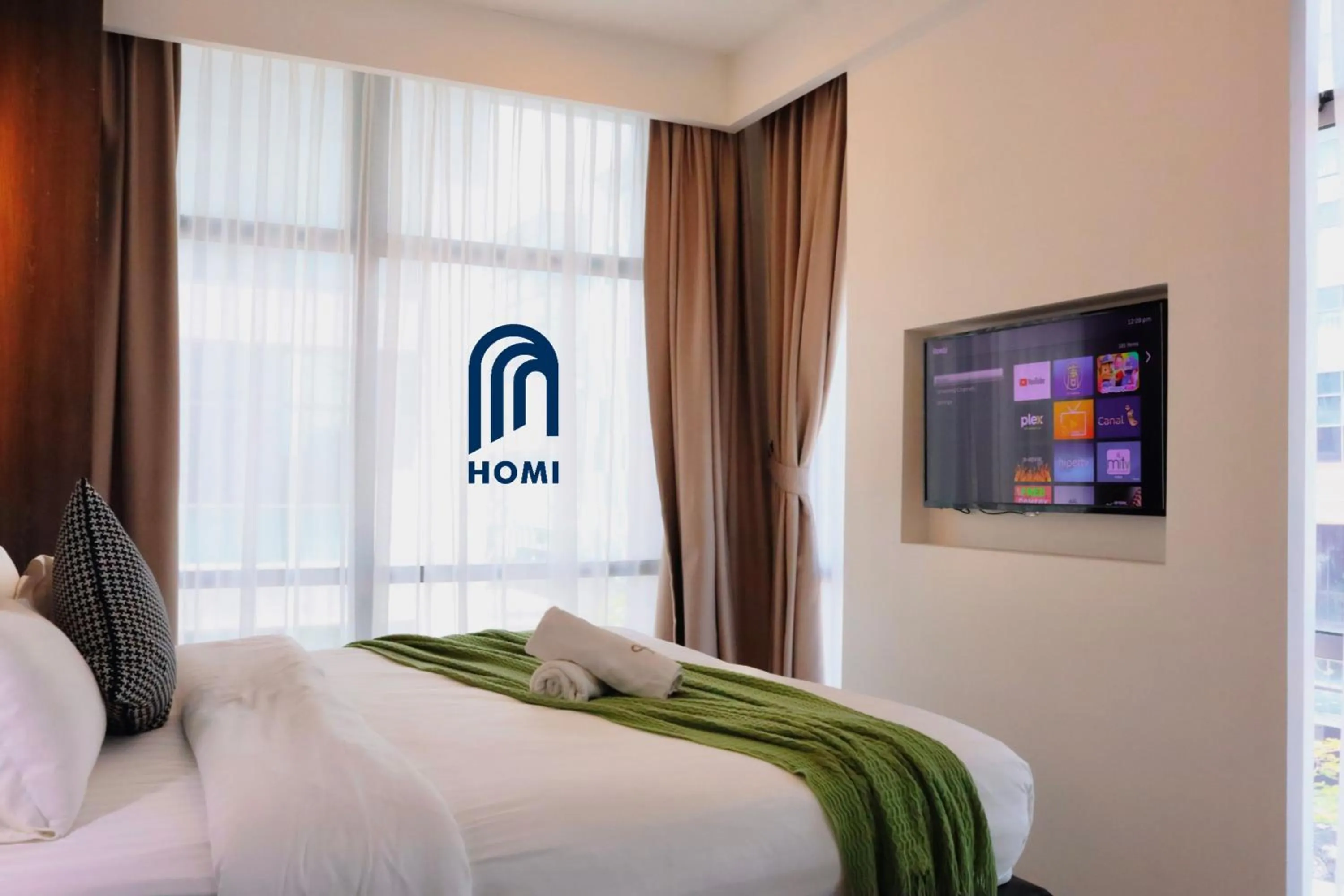 Photo of the whole room, Bed in Homi Oasis at KK Times Square 和逸绿洲