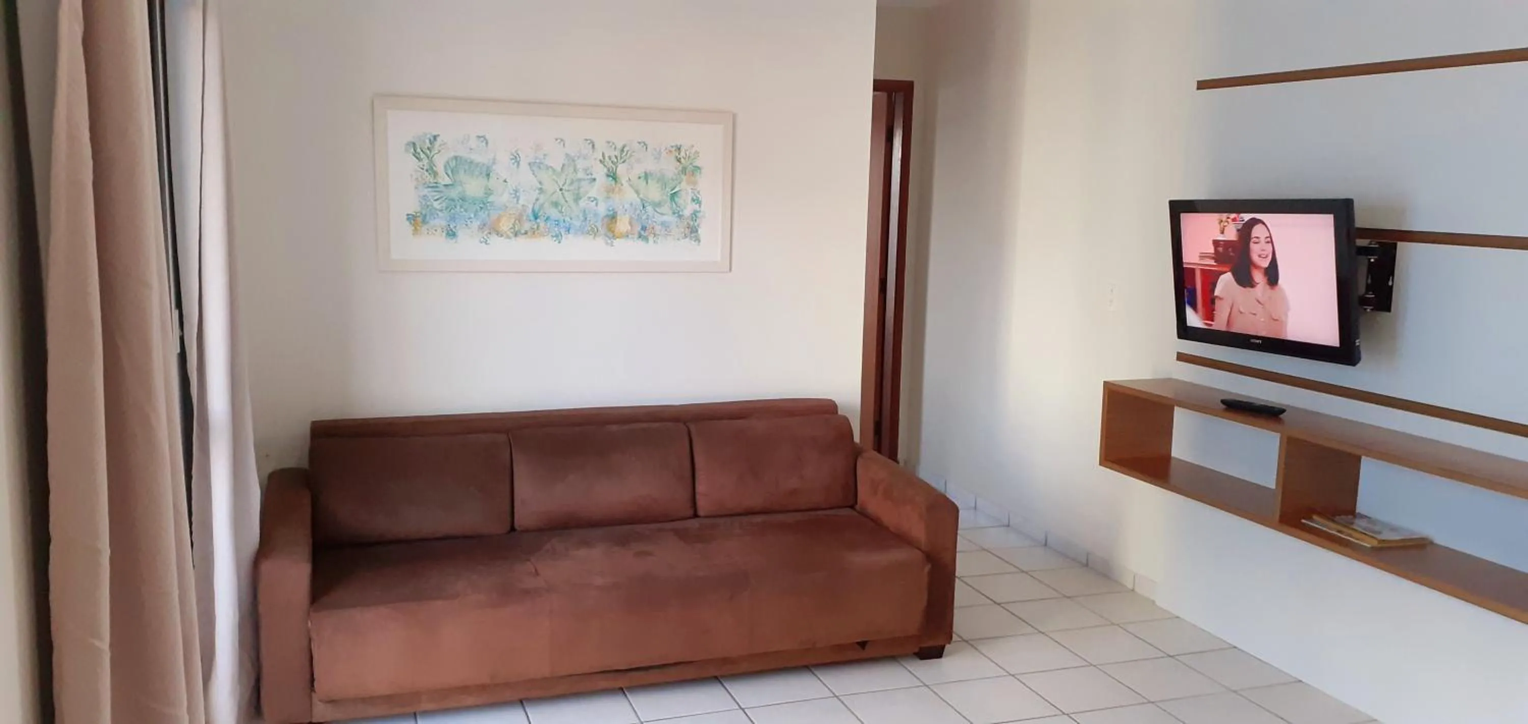 Communal lounge/ TV room in Hotel Jangada Flat