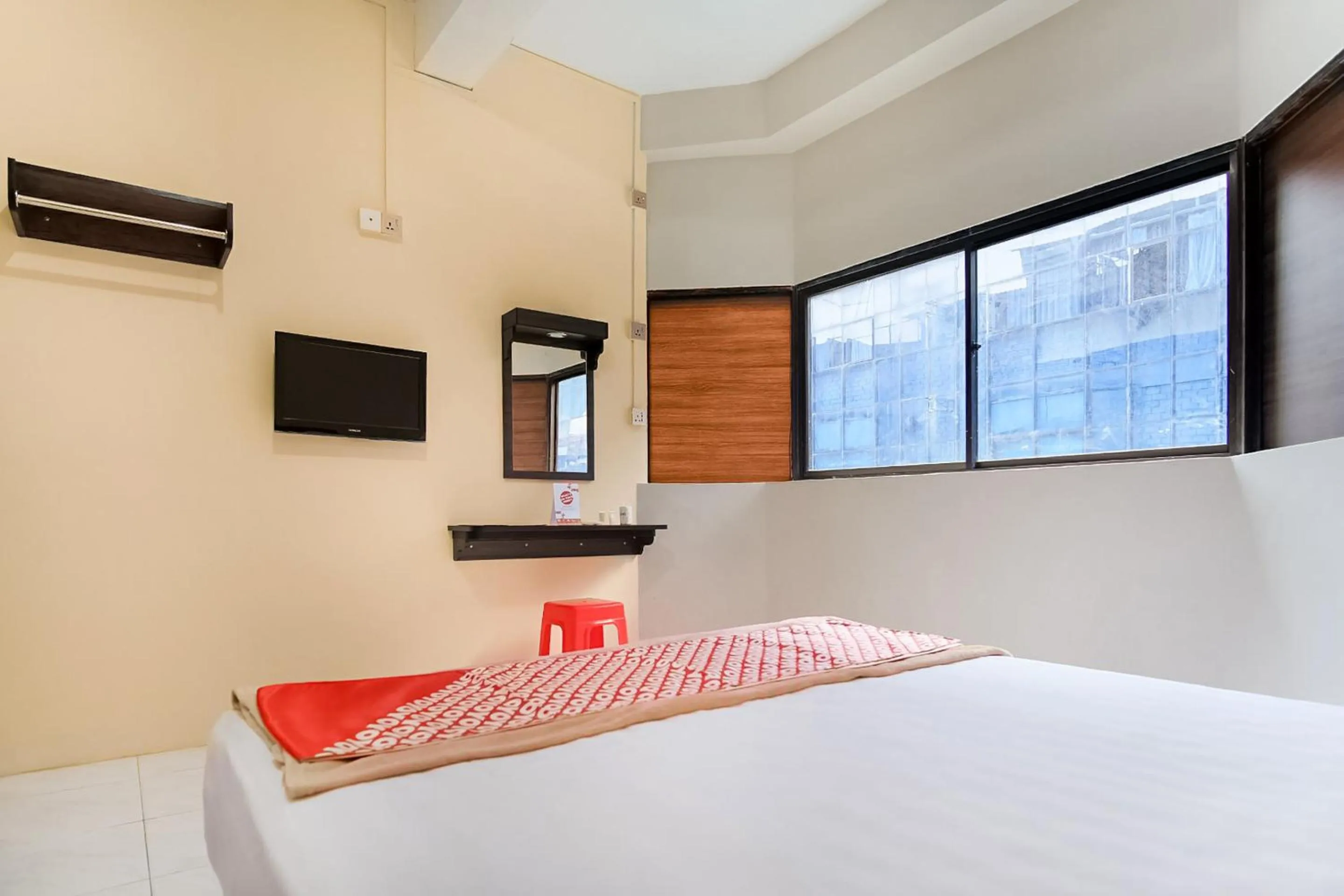 Bedroom in OYO 3212 Coffee Jodoh Homestay