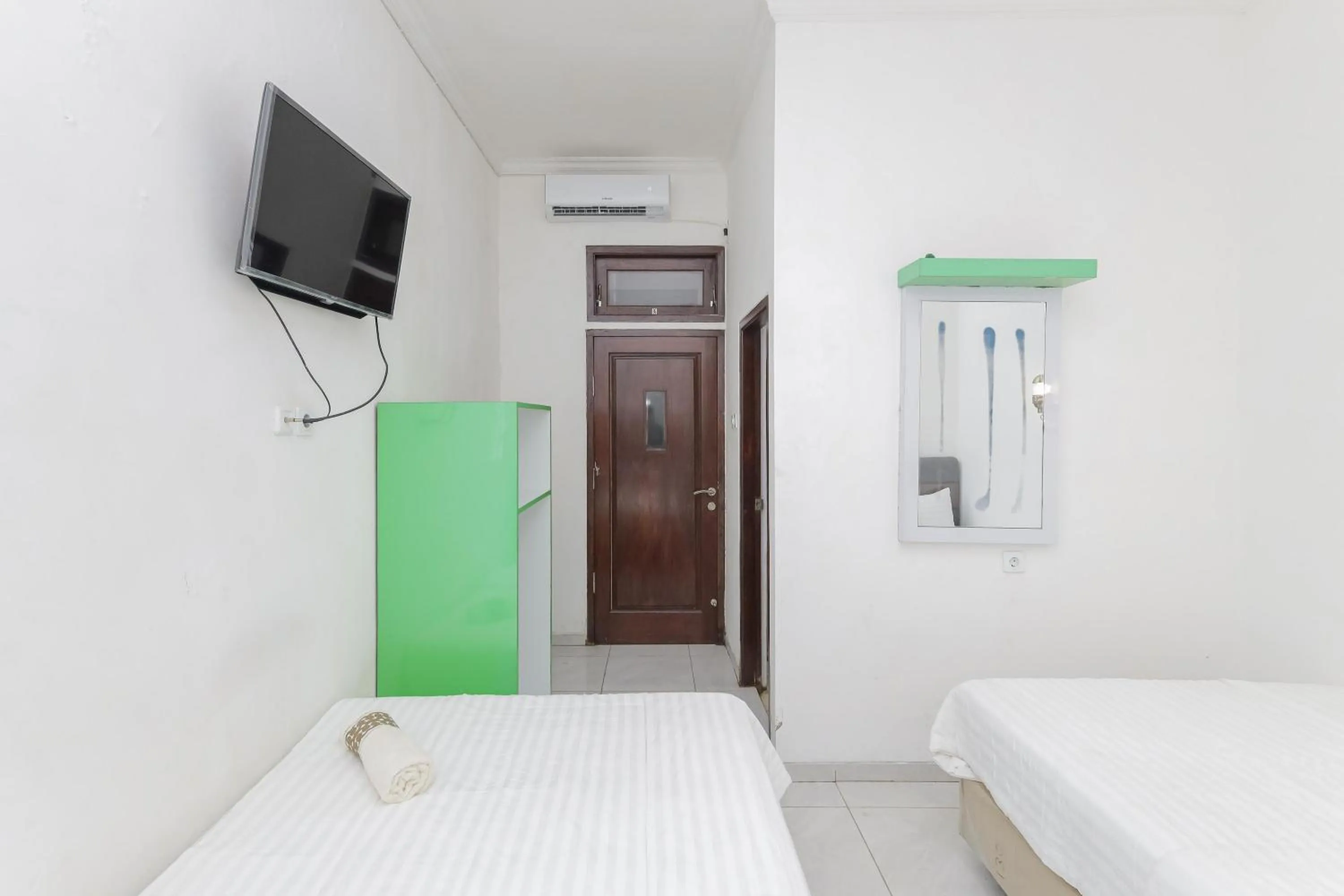 Bedroom in Urbanview Hotel Near Jatim Park 3 by RedDoorz
