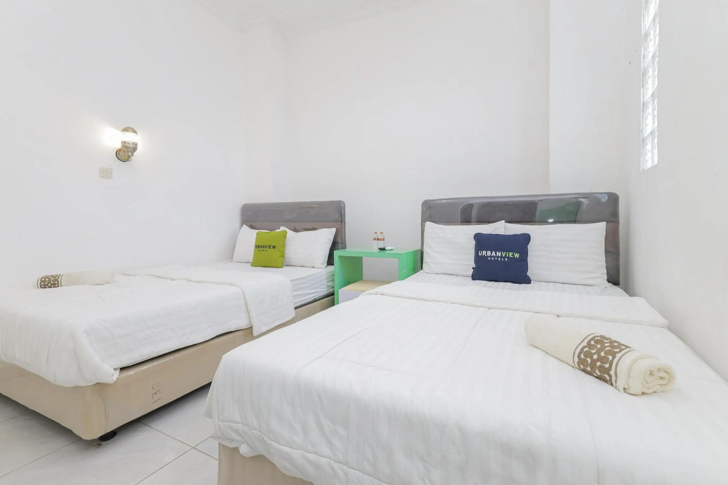 Bedroom in Urbanview Hotel Near Jatim Park 3 by RedDoorz