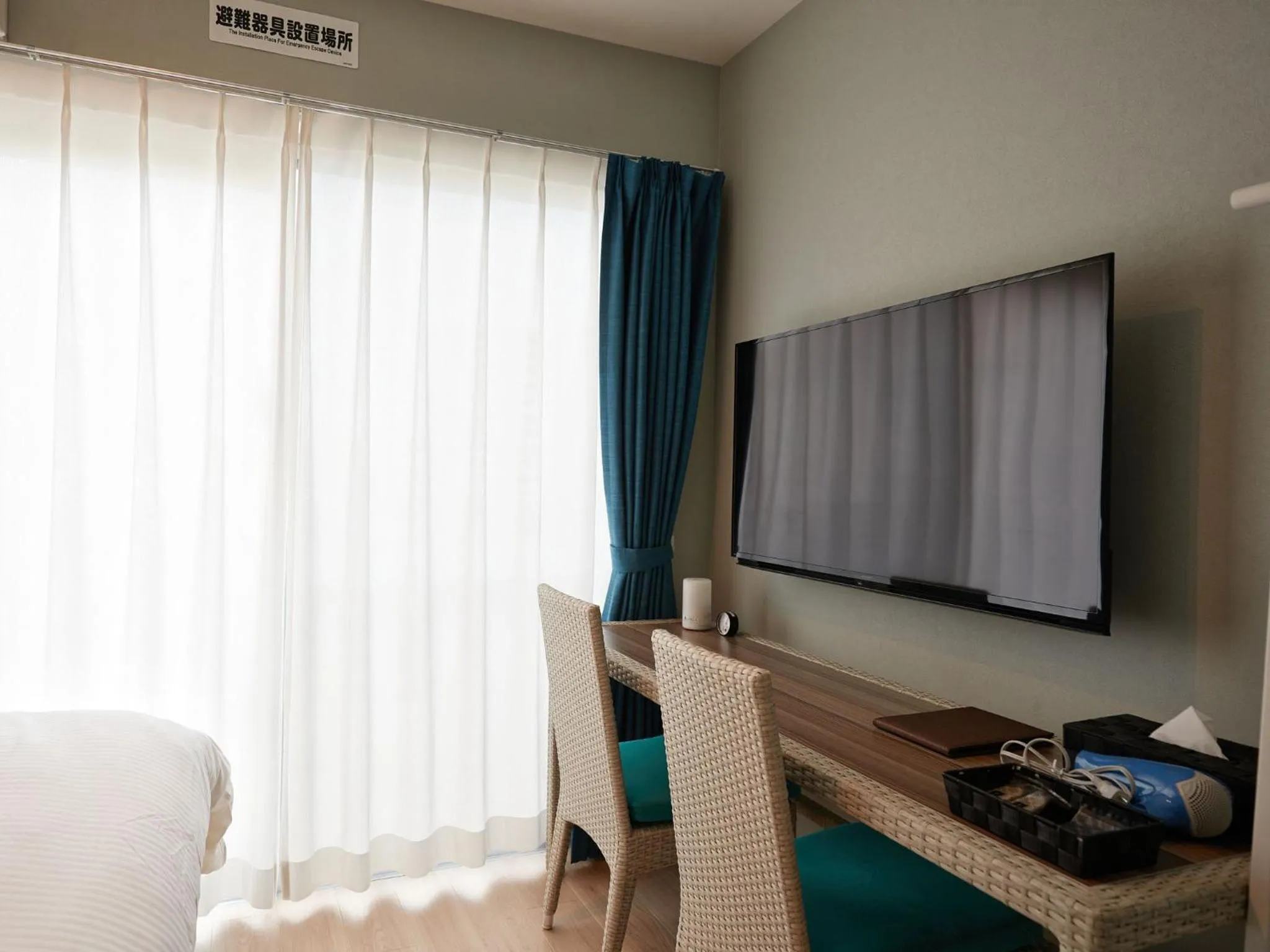 Photo of the whole room, TV/Entertainment Center in Tenpoint Hotel OKOU