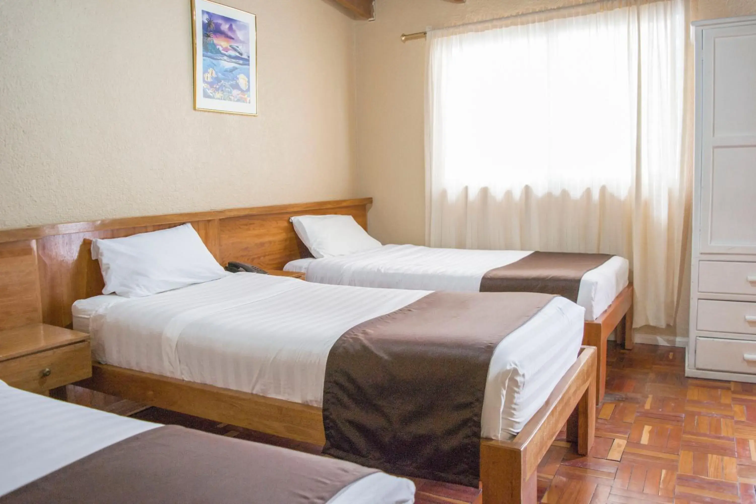 Classic Quadruple Room in Hostal Loro Verde Classic Quadruple Room in Hostal Loro Verde