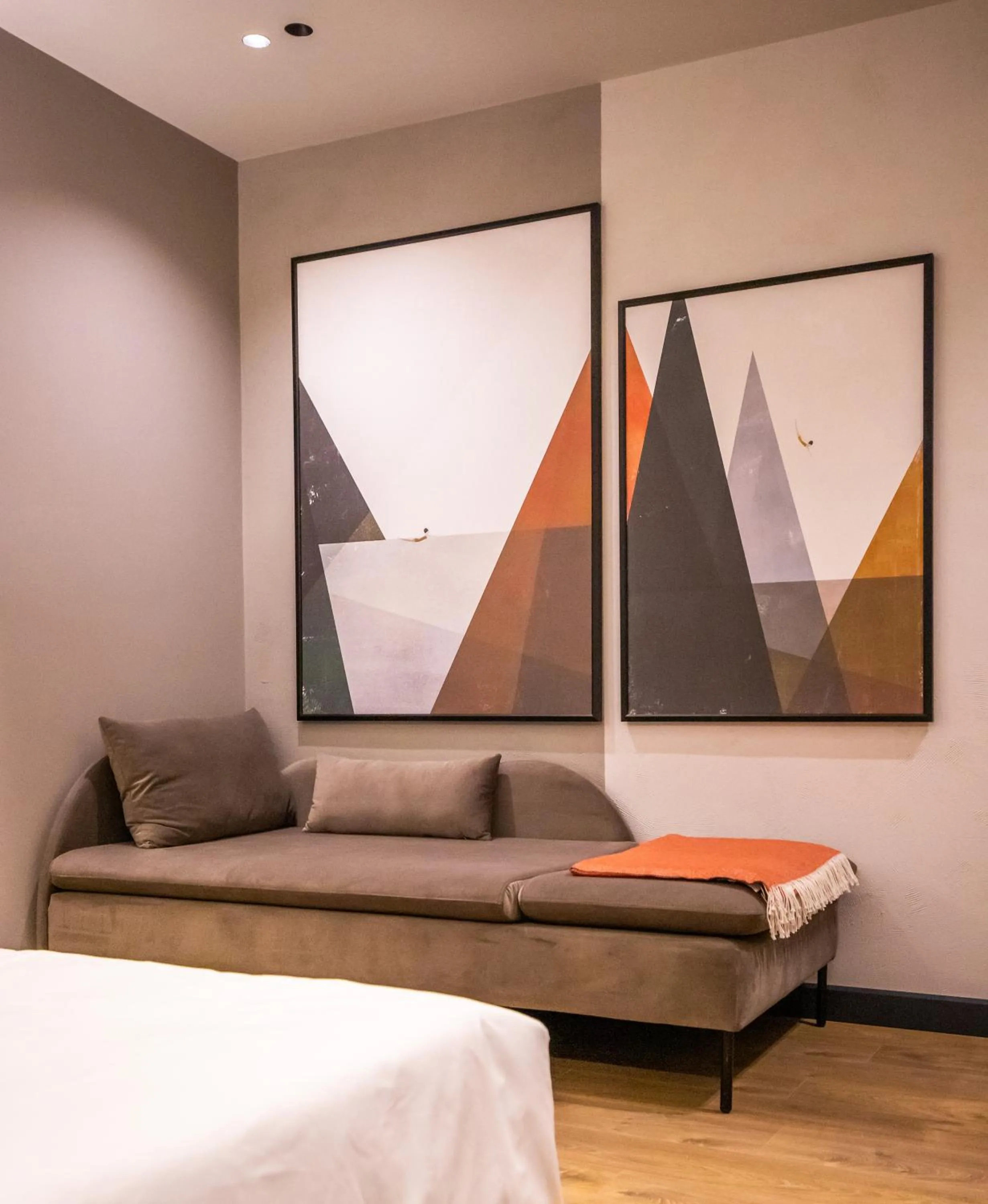 Seating area, Bed in Allure Boutique Hotel