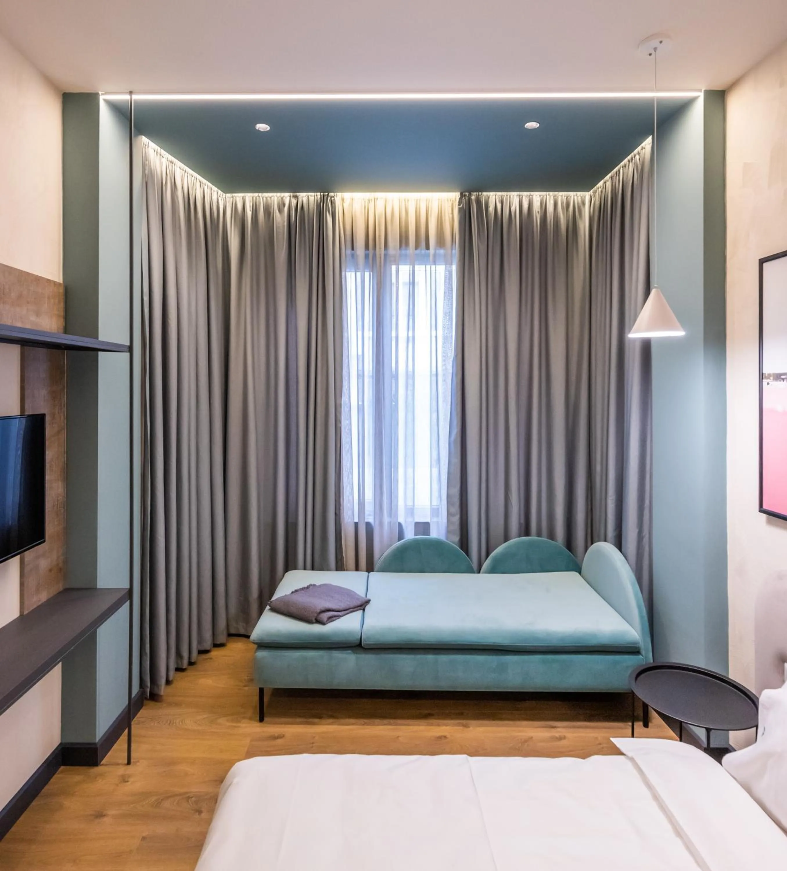 Seating area, Bed in Allure Boutique Hotel