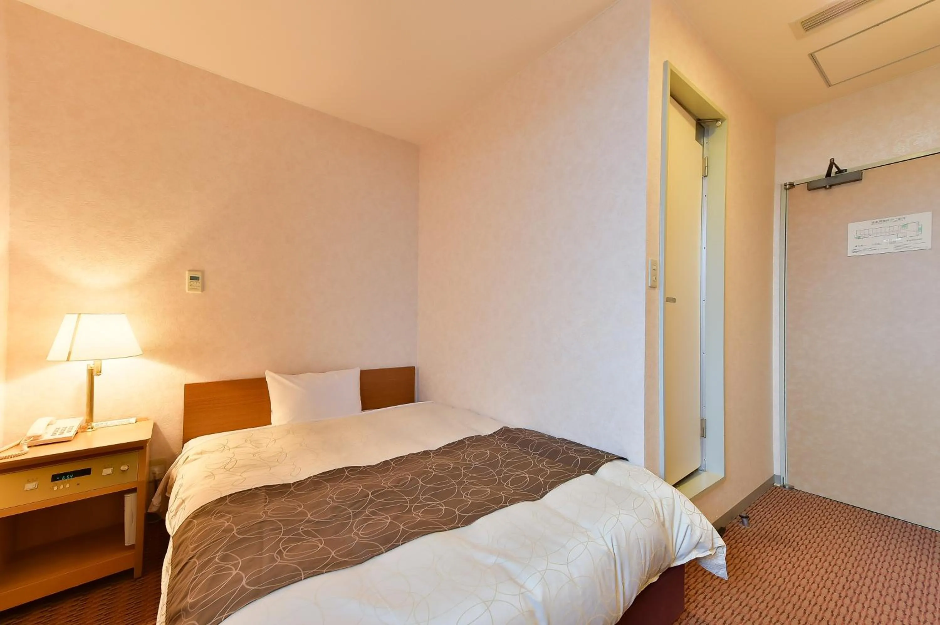 Bed in KKR Kyoto Kuniso