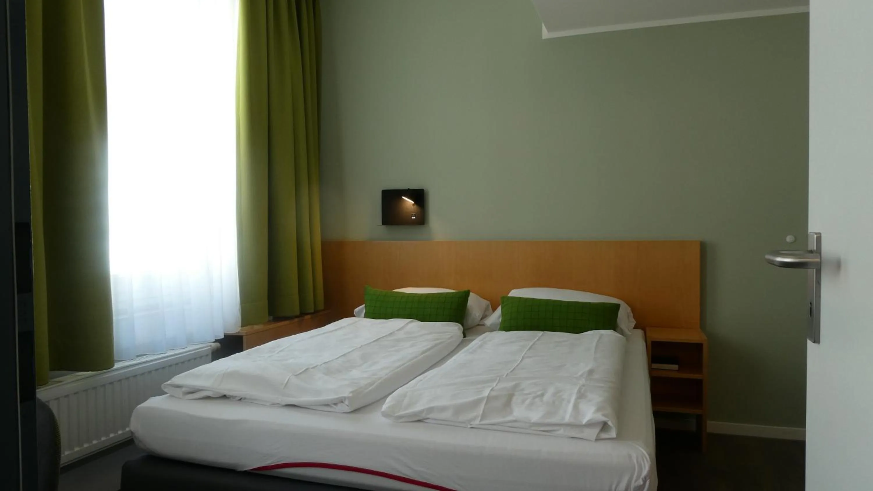 Photo of the whole room, Bed in CVJM Düsseldorf Hotel & Tagung