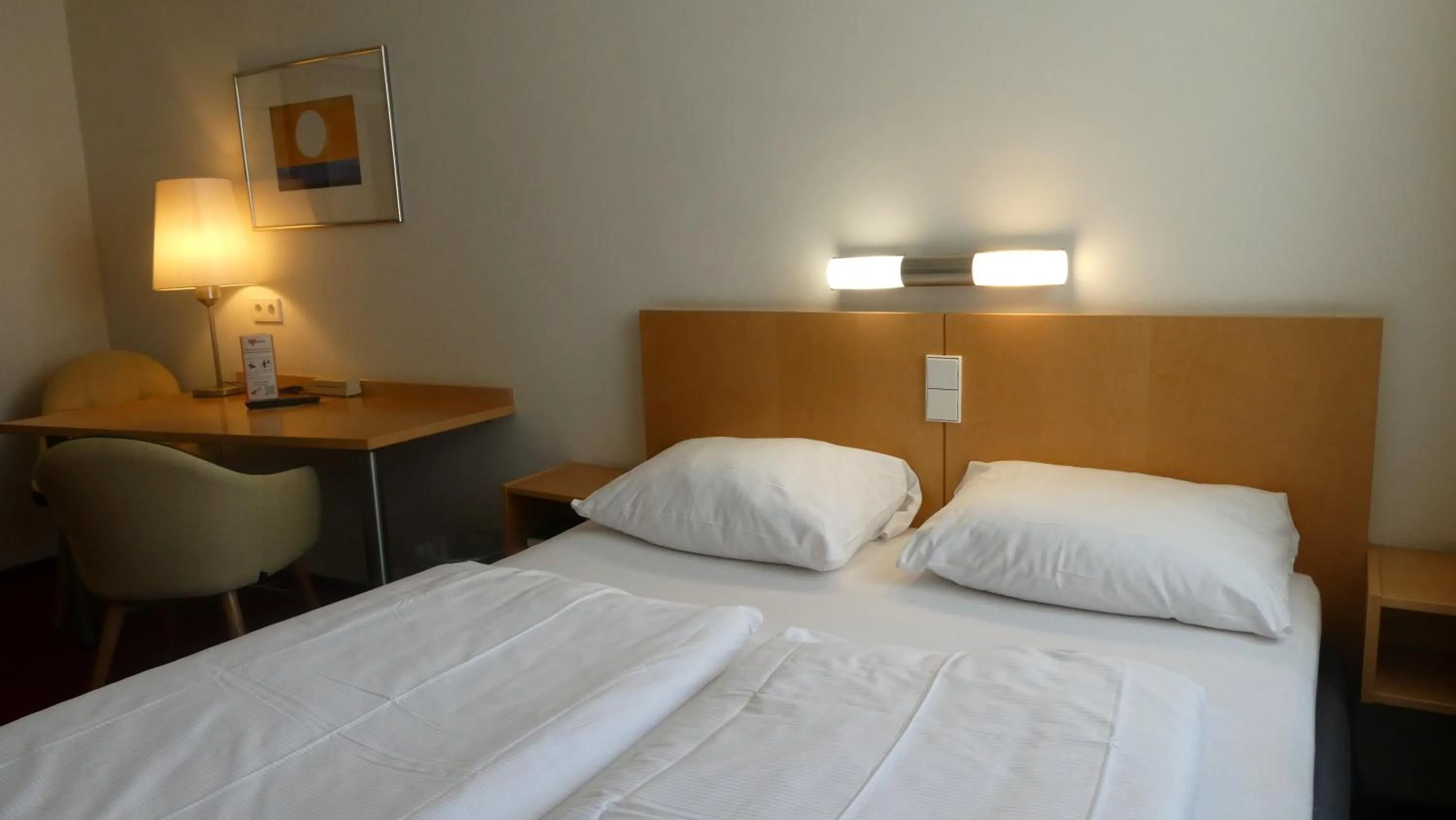 Photo of the whole room, Bed in CVJM Düsseldorf Hotel & Tagung