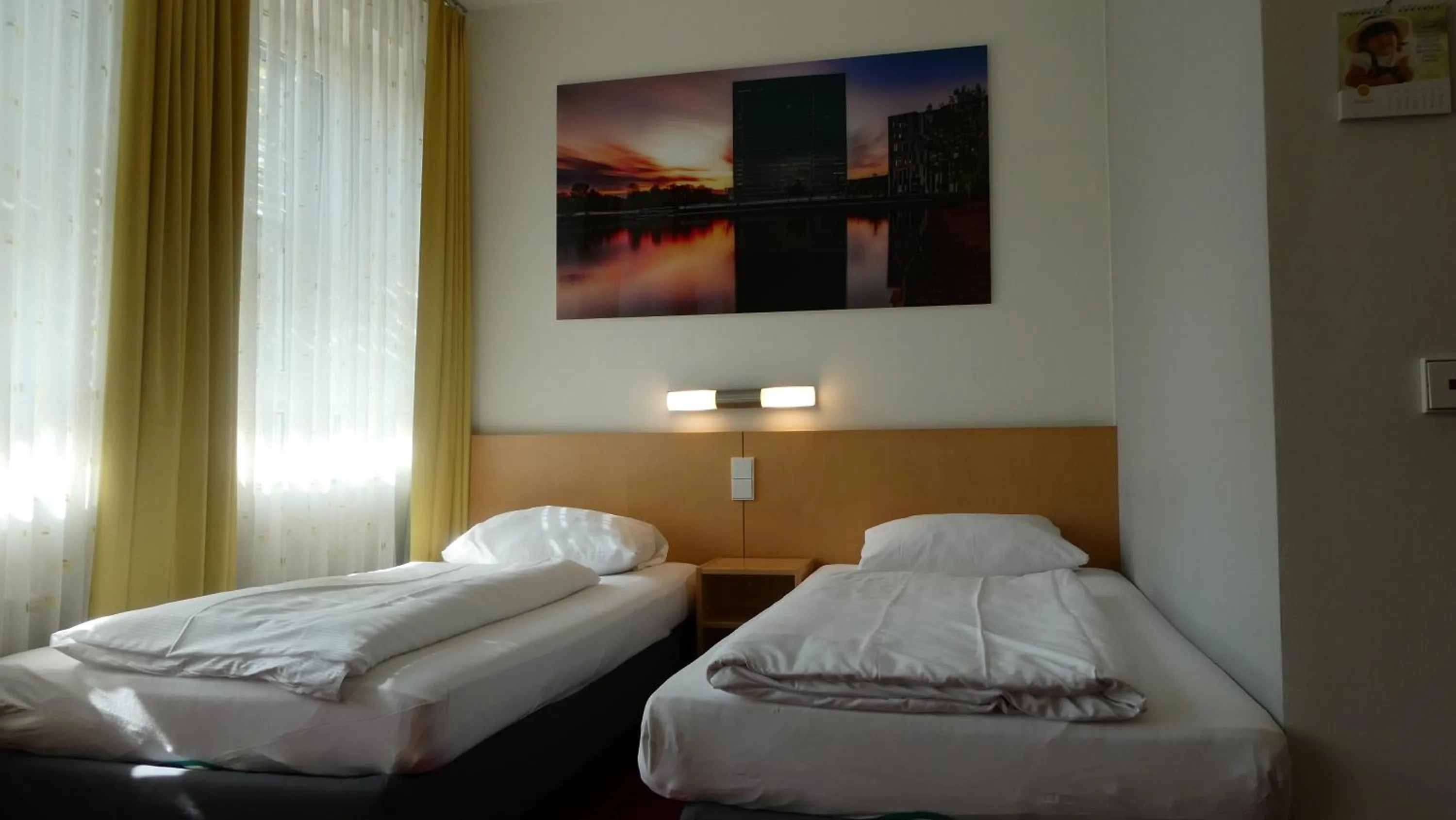 Photo of the whole room, Bed in CVJM Düsseldorf Hotel & Tagung