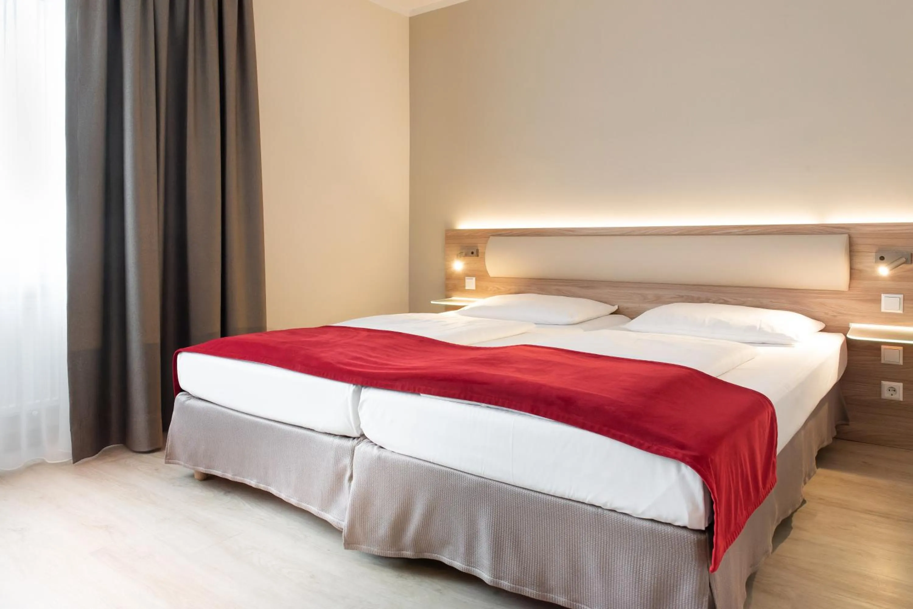 Bed in Hotel Königshof am Funkturm