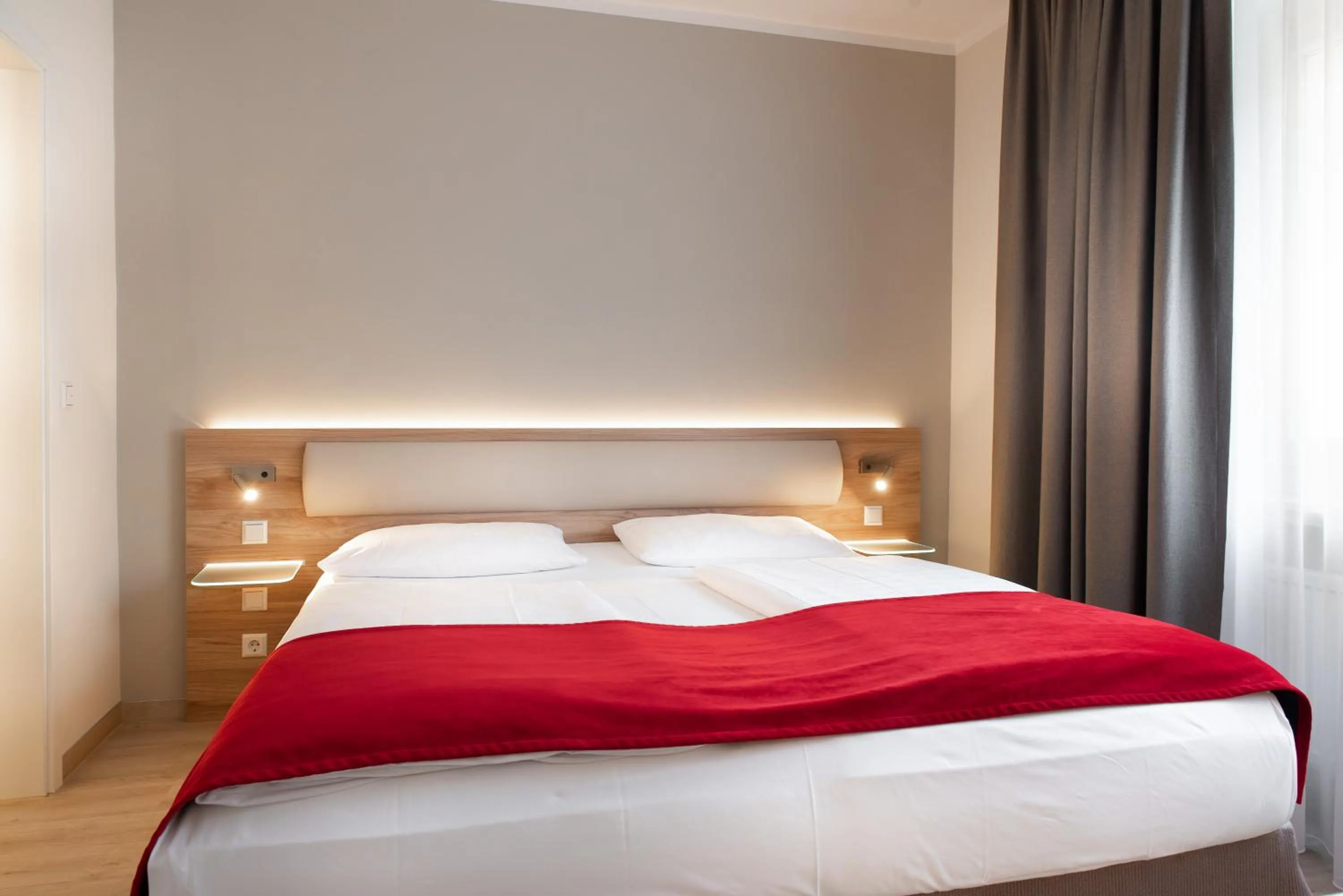 Bed in Hotel Königshof am Funkturm