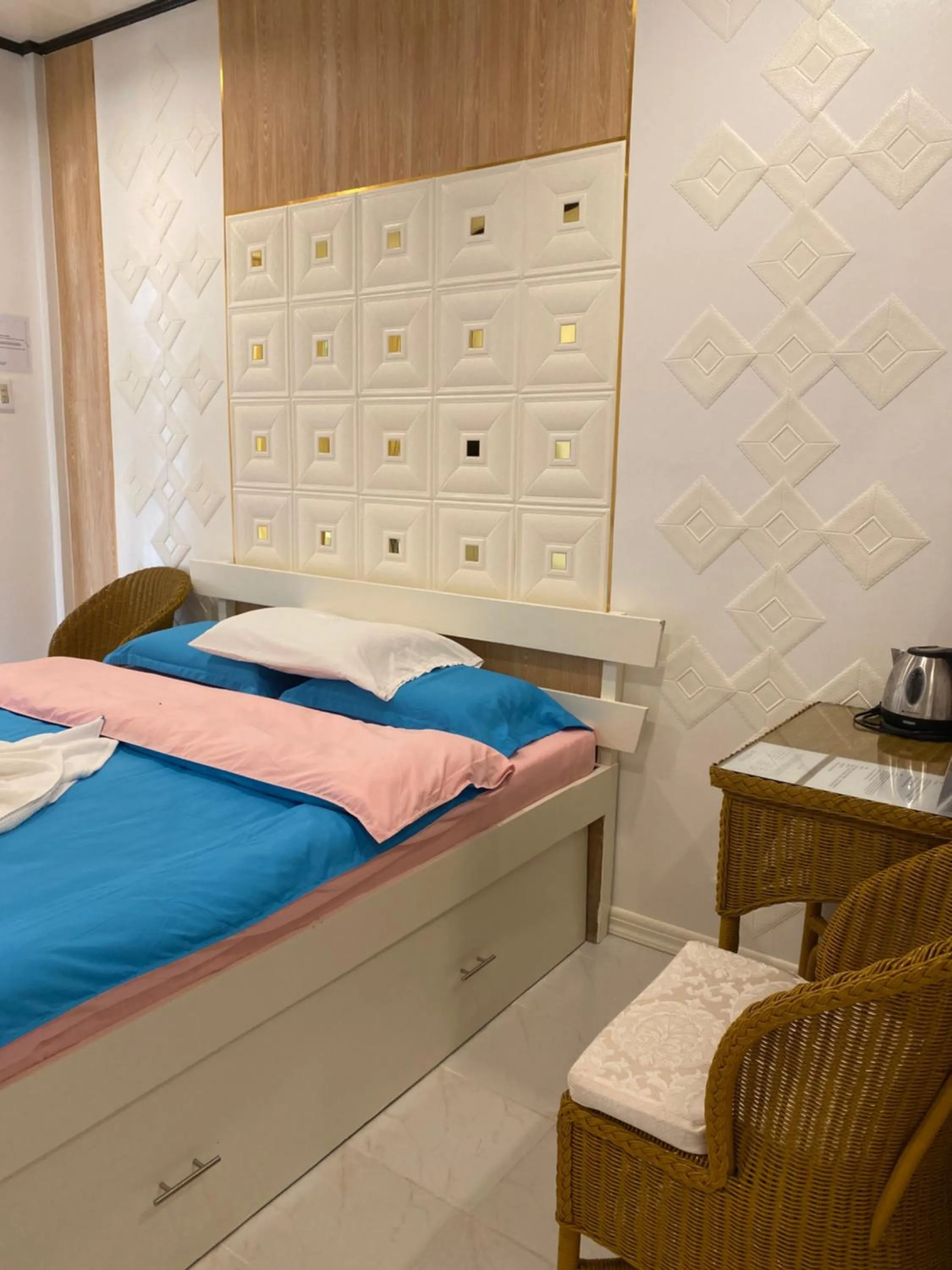 Bed in Monallan Boracay Hotel