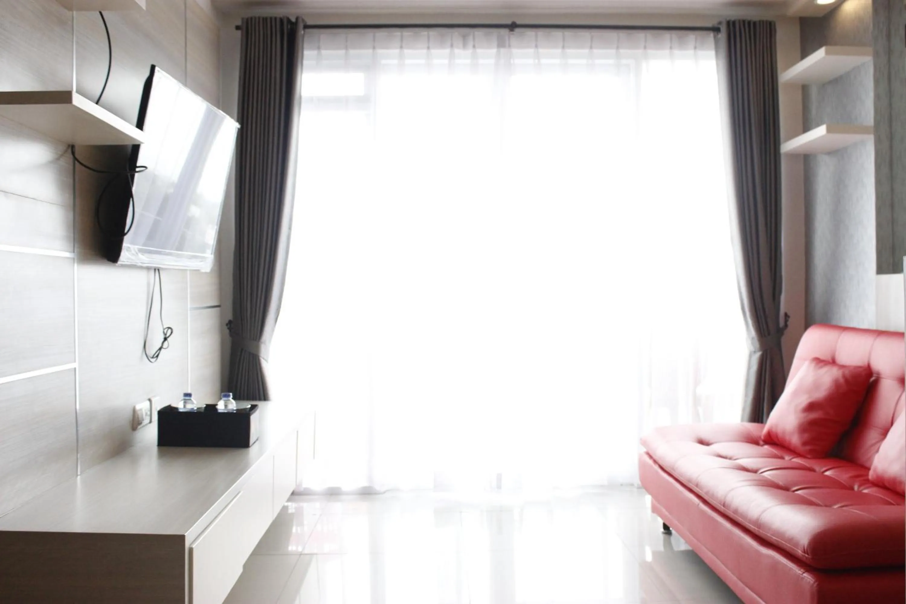 Bright and Stylish 2BR at Gateway Pasteur Apartment By Travelio