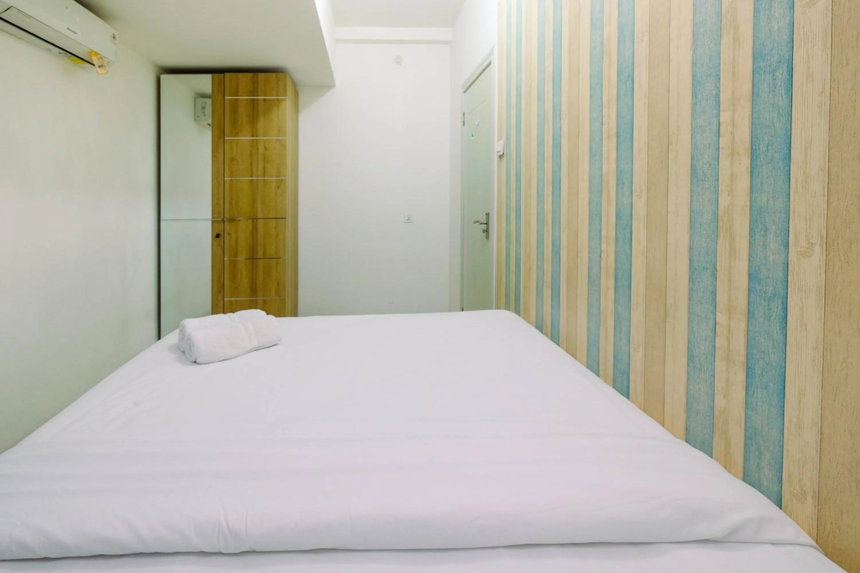 Bed in Best Price 1BR Apartment at Teluk Intan By Travelio