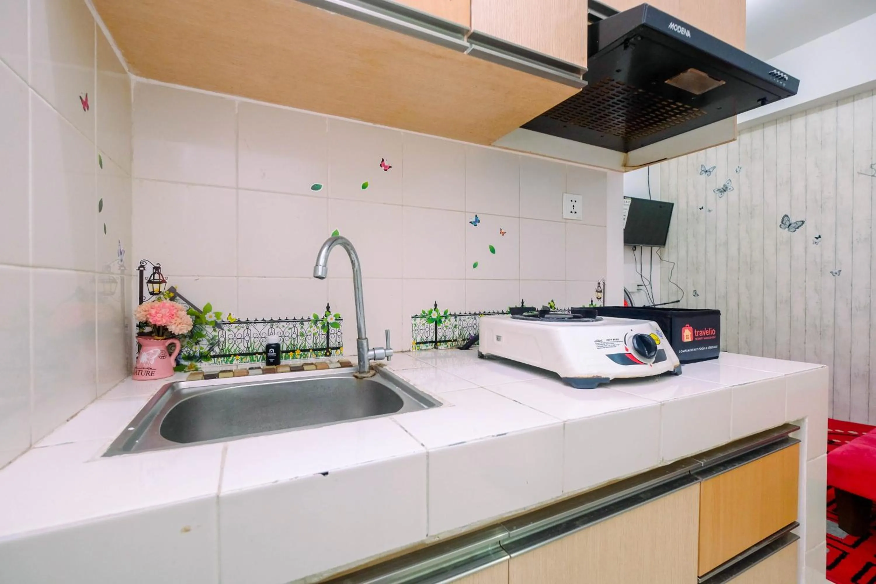Kitchen or kitchenette in Best Price 1BR Apartment at Teluk Intan By Travelio