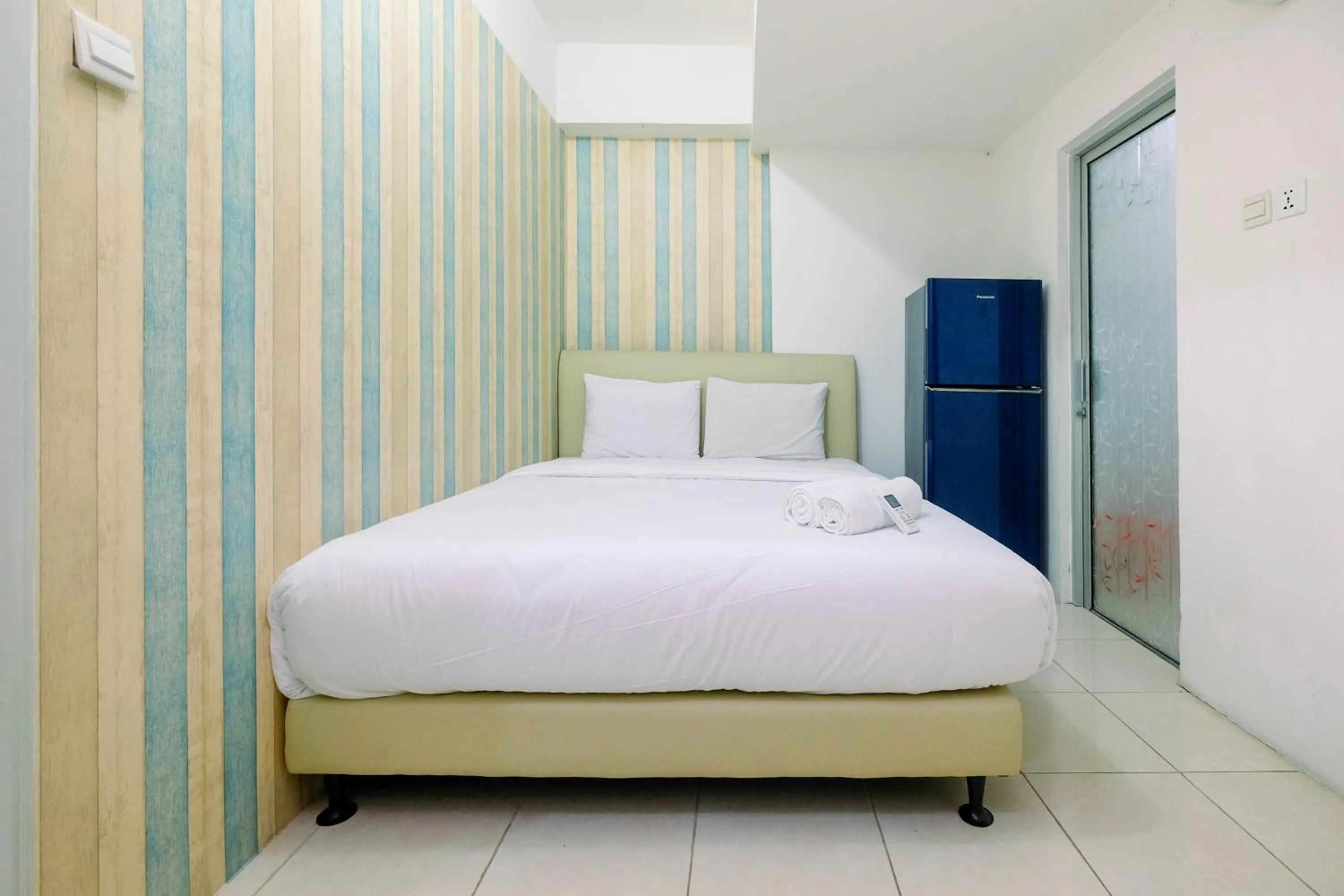 Bed in Best Price 1BR Apartment at Teluk Intan By Travelio