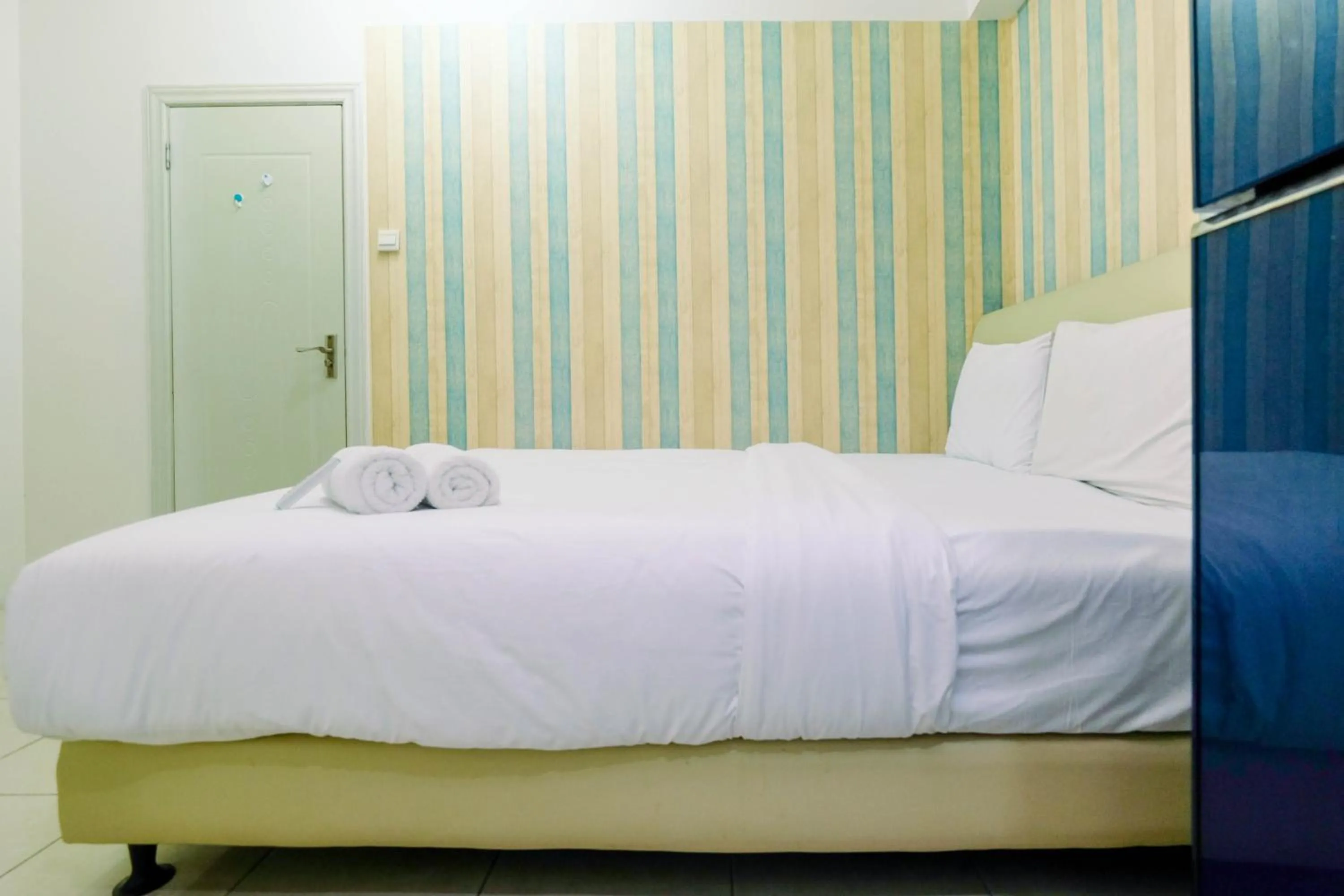 Bed in Best Price 1BR Apartment at Teluk Intan By Travelio