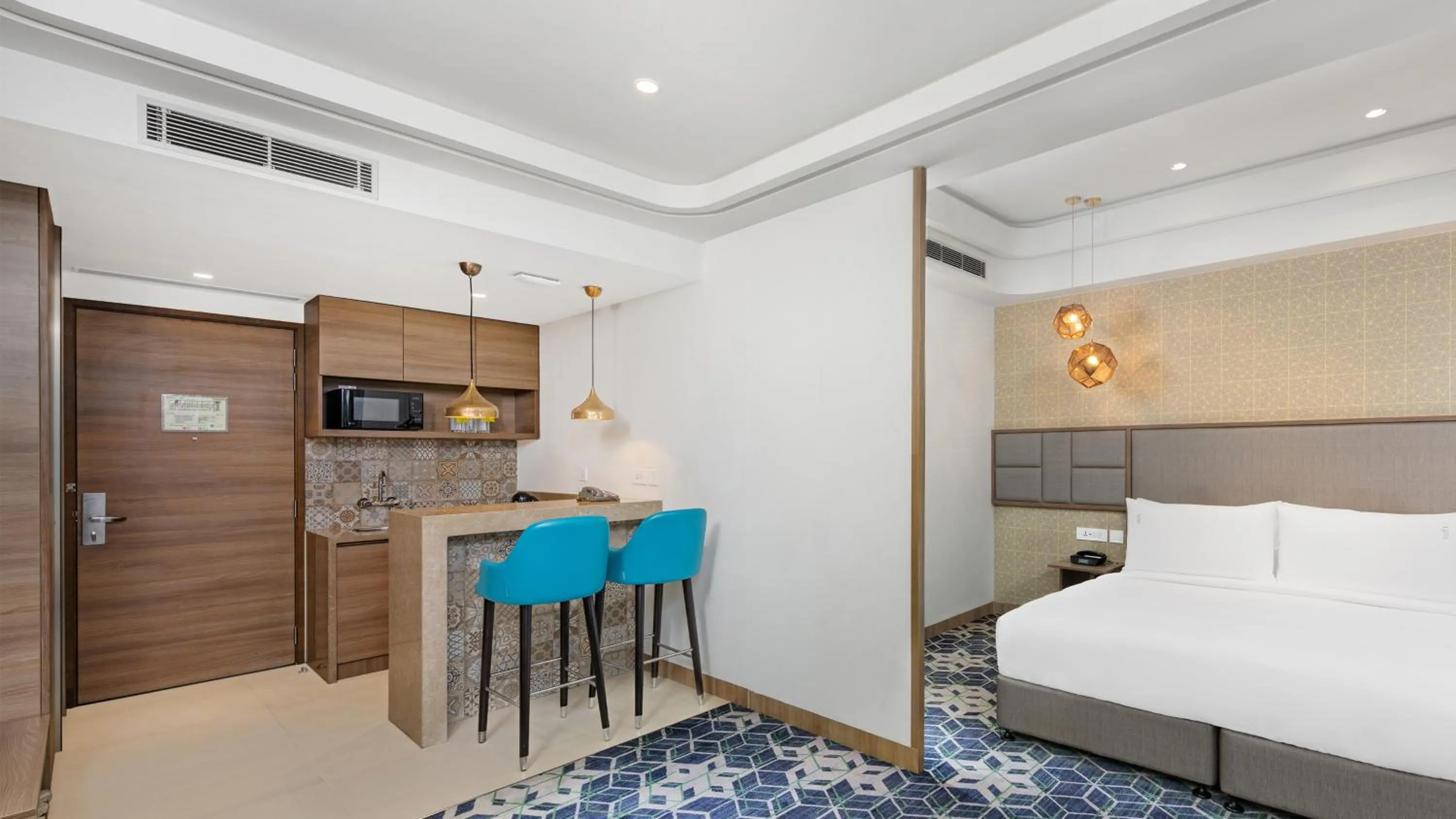 Living room, Bed in Holiday Inn Gurugram Sector 90 by IHG