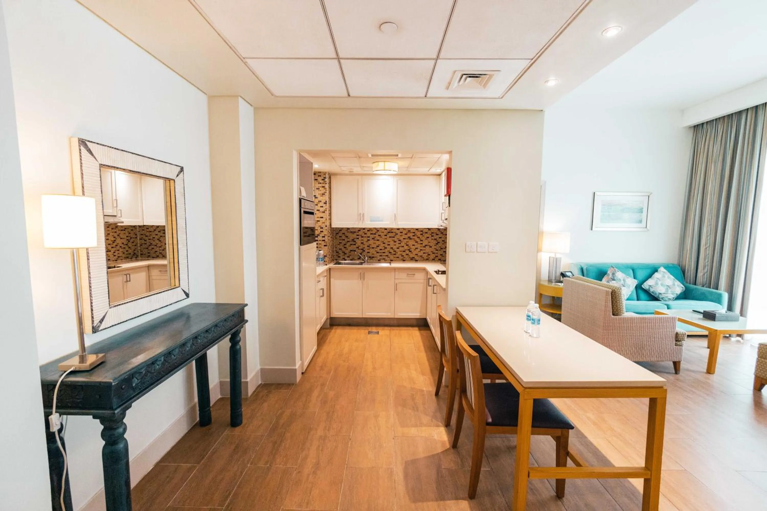 Kitchen or kitchenette, Bed in Salalah Gardens Hotel Managed by Safir Hotels & Resorts