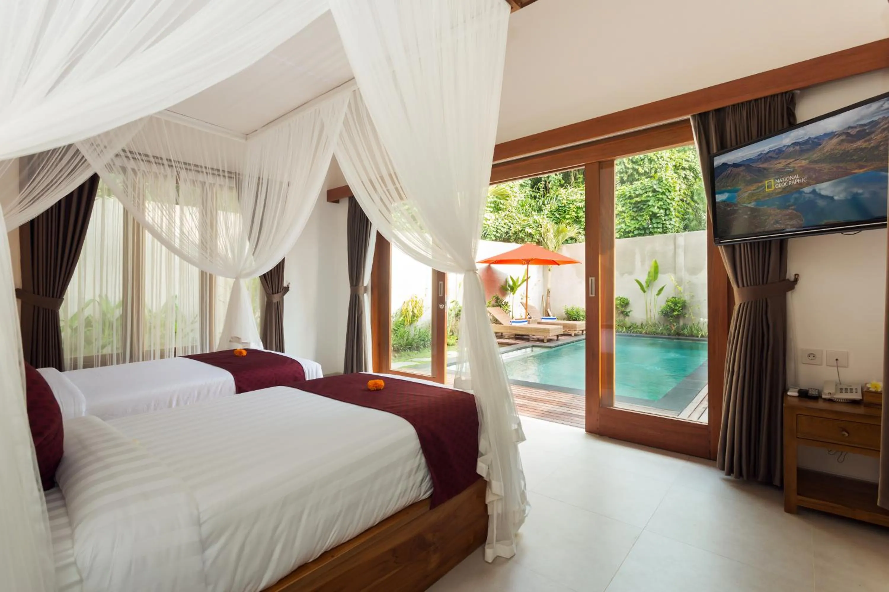 Bed in de Metra Villa Ubud by GenuineHost