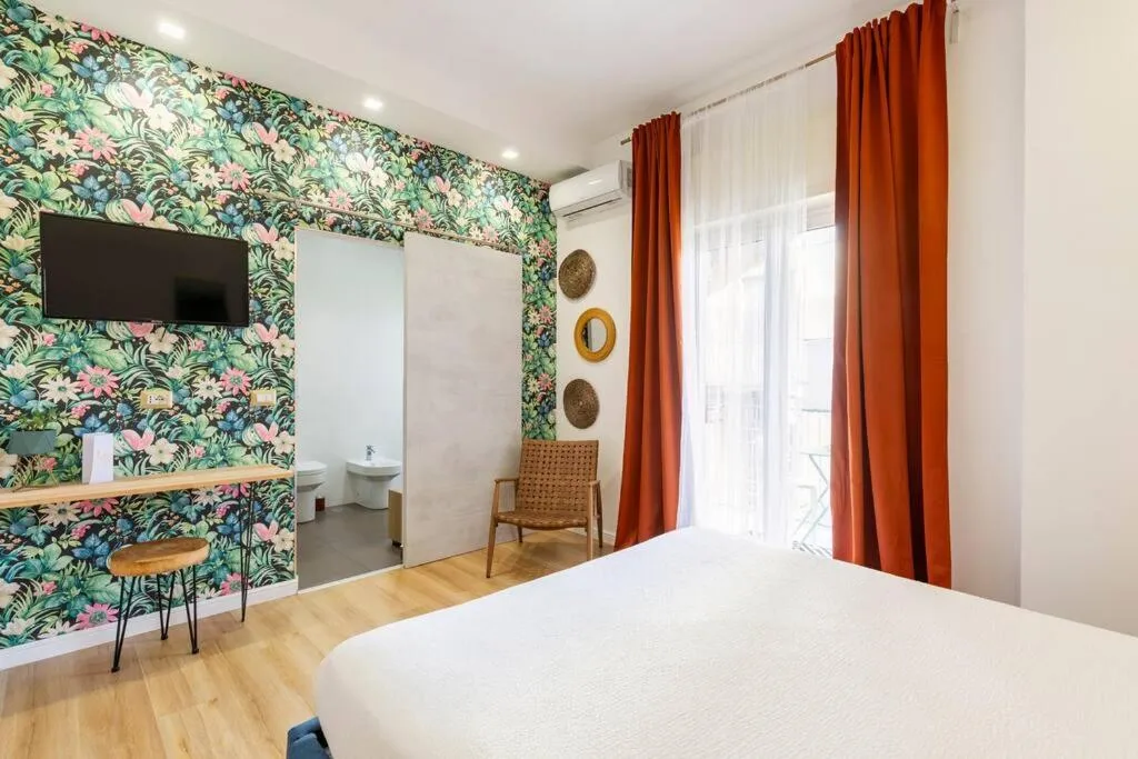 Communal lounge/ TV room, Bed in Tufo Giallo Rooms