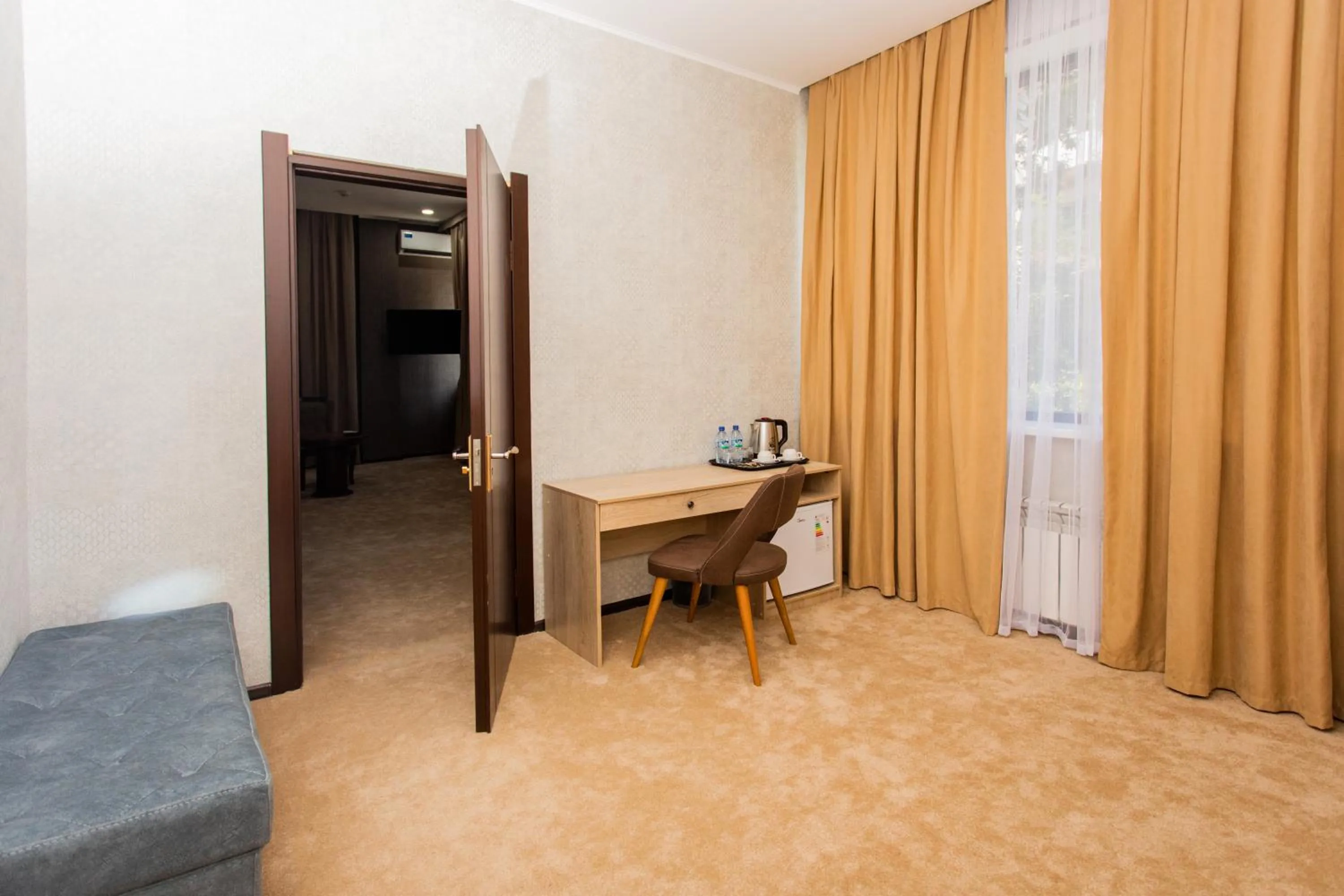 Communal lounge/ TV room in Gabrielle International Hotel