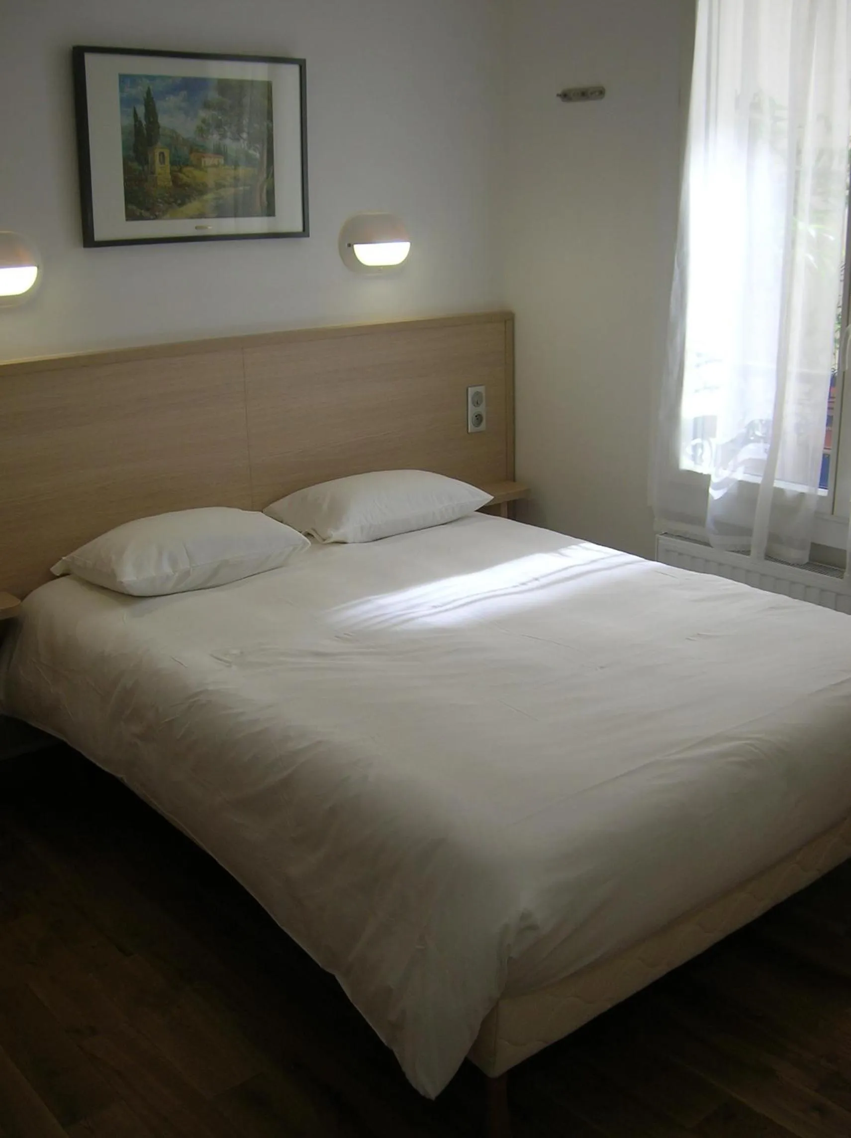 Bed in Hotel Darcet