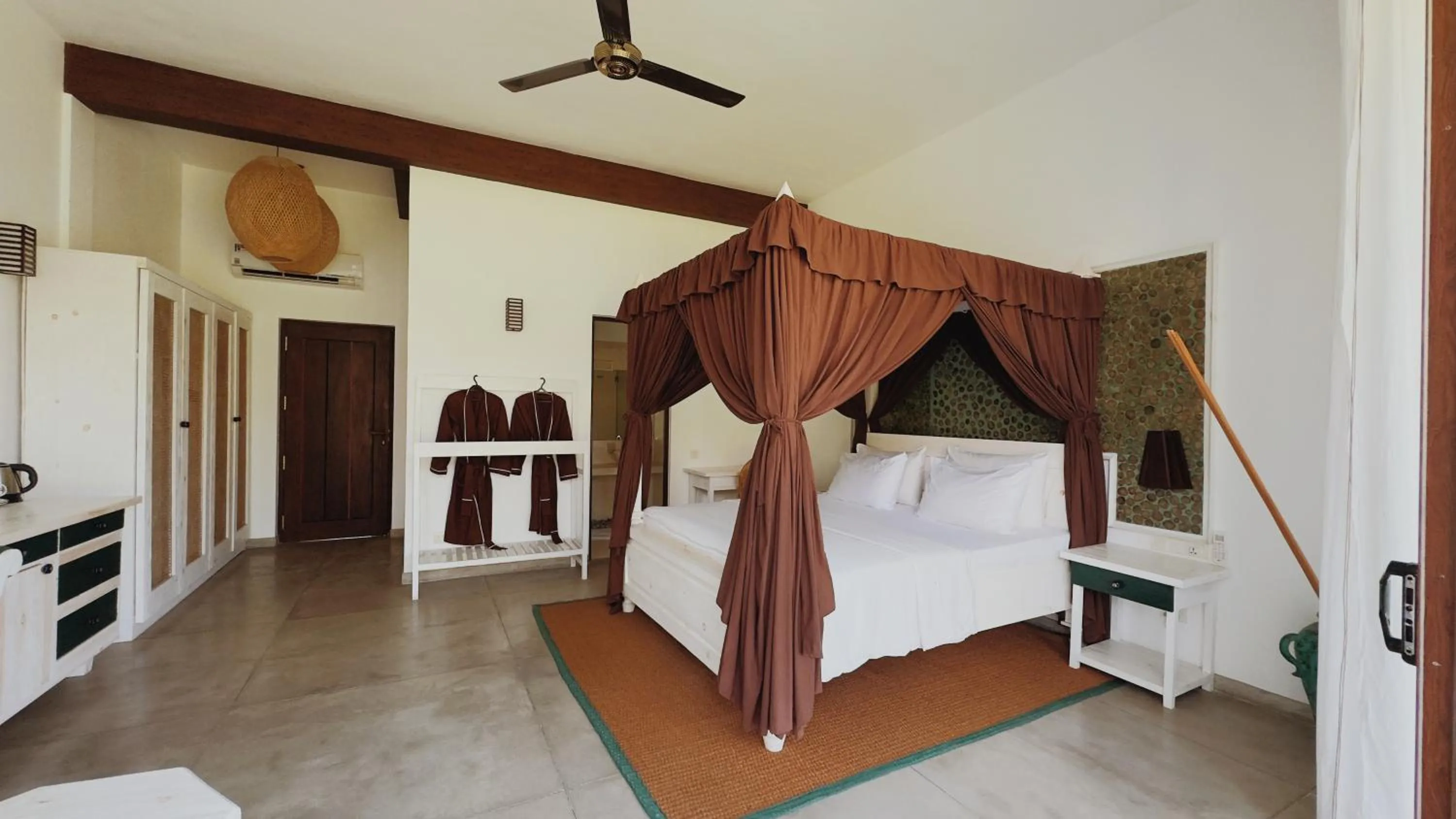 Bed in Palm Garden Ayurveda Resort