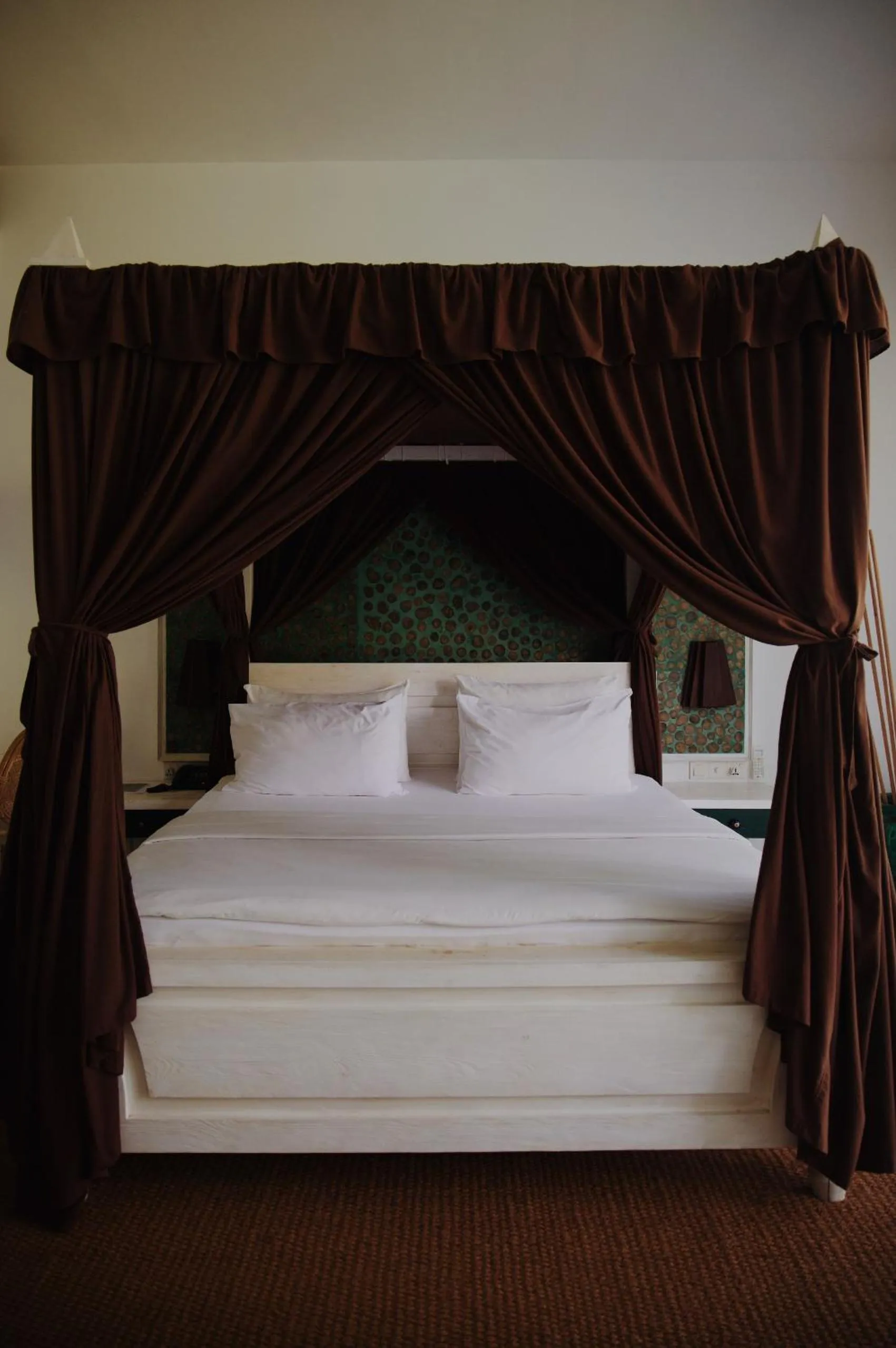 Bed in Palm Garden Ayurveda Resort
